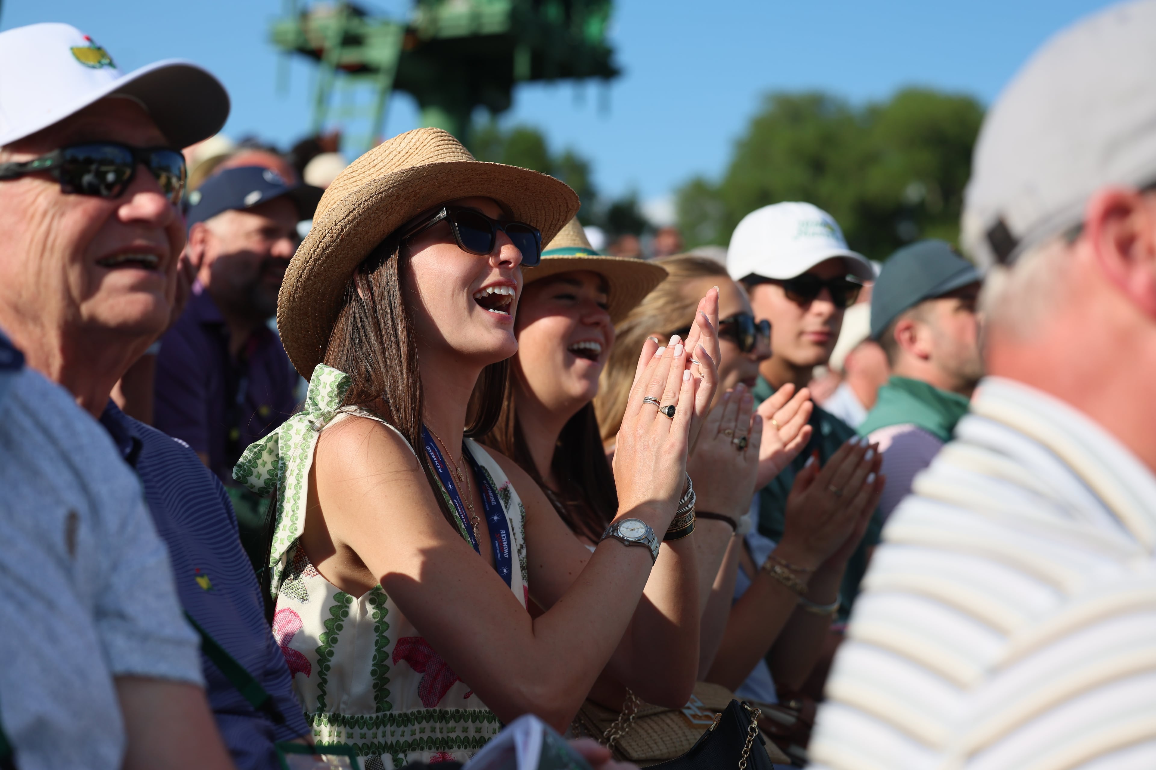 Patrons react after Scottie Scheffler's score is update following a birdie on 16th hole during final round of the Masters, at Augusta National Golf Club, Sunday, April 12, 2026, in Augusta, GA (Jason Getz/AJC)