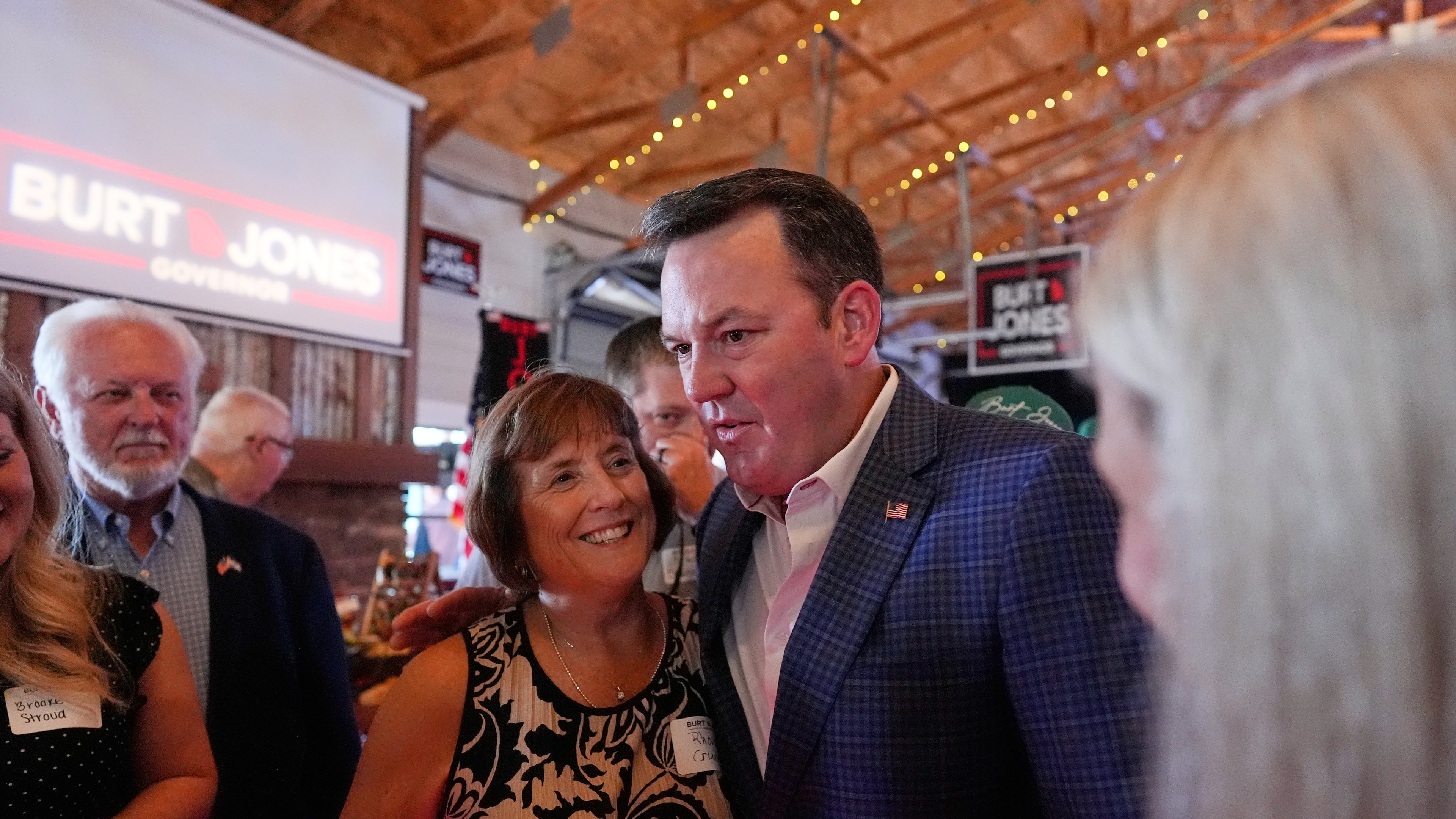 Georgia gubernatorial candidate Burt Jones meets with supporters during a primary election night watch party, Tuesday, May 19, 2026, in Jackson, Ga. (AP Photo/Mike Stewart)