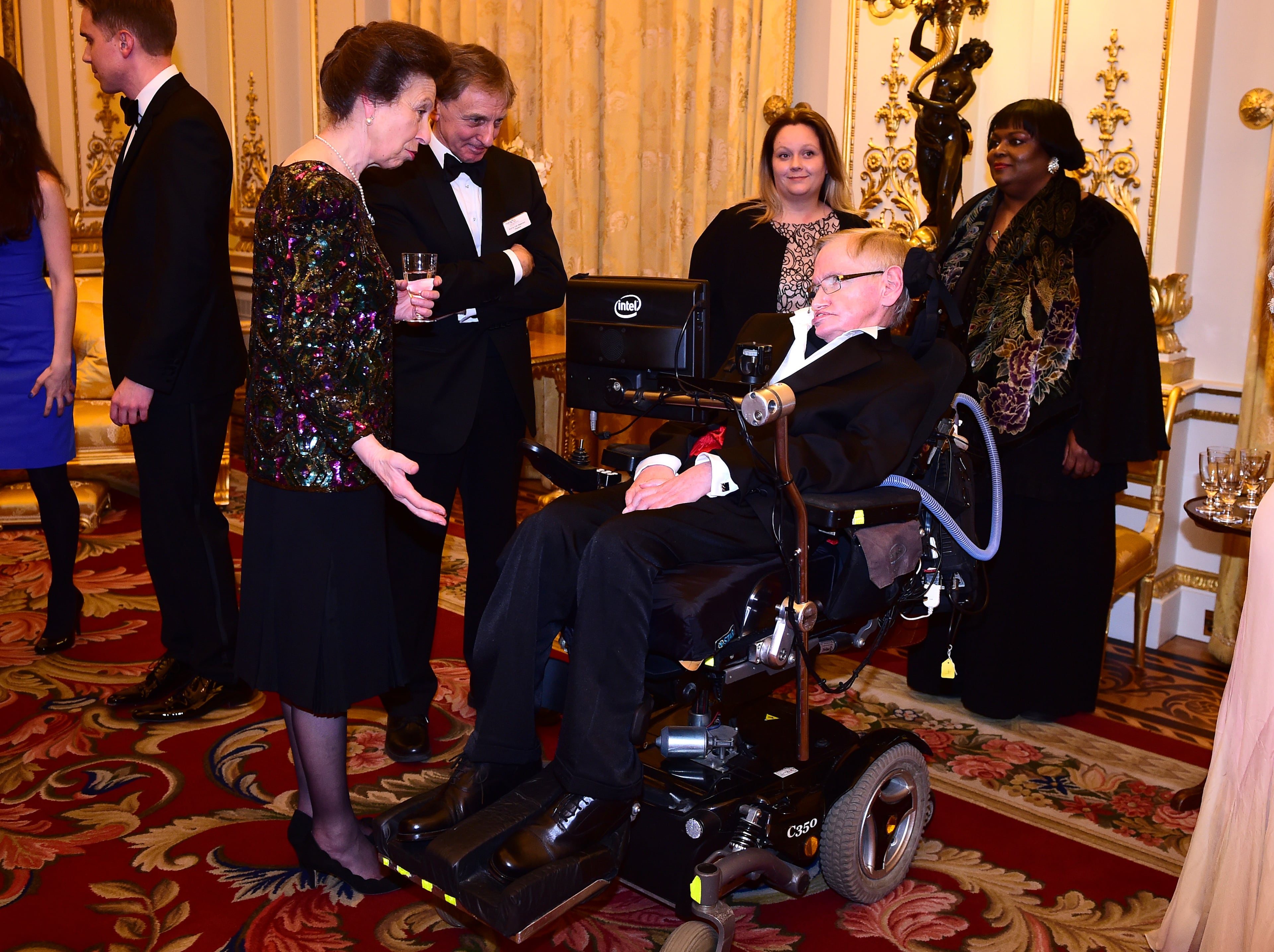LONDON, ENGLAND - MARCH 10: Princess Anne, Princess Royal and Professor Stephen Hawking talk as they attend a reception and dinner in support of Motor Neurone Disease Association at Buckingham Palace on March 10, 2015 in London, United Kingdom. (Photo by Ian West - WPA Pool/Getty Images)