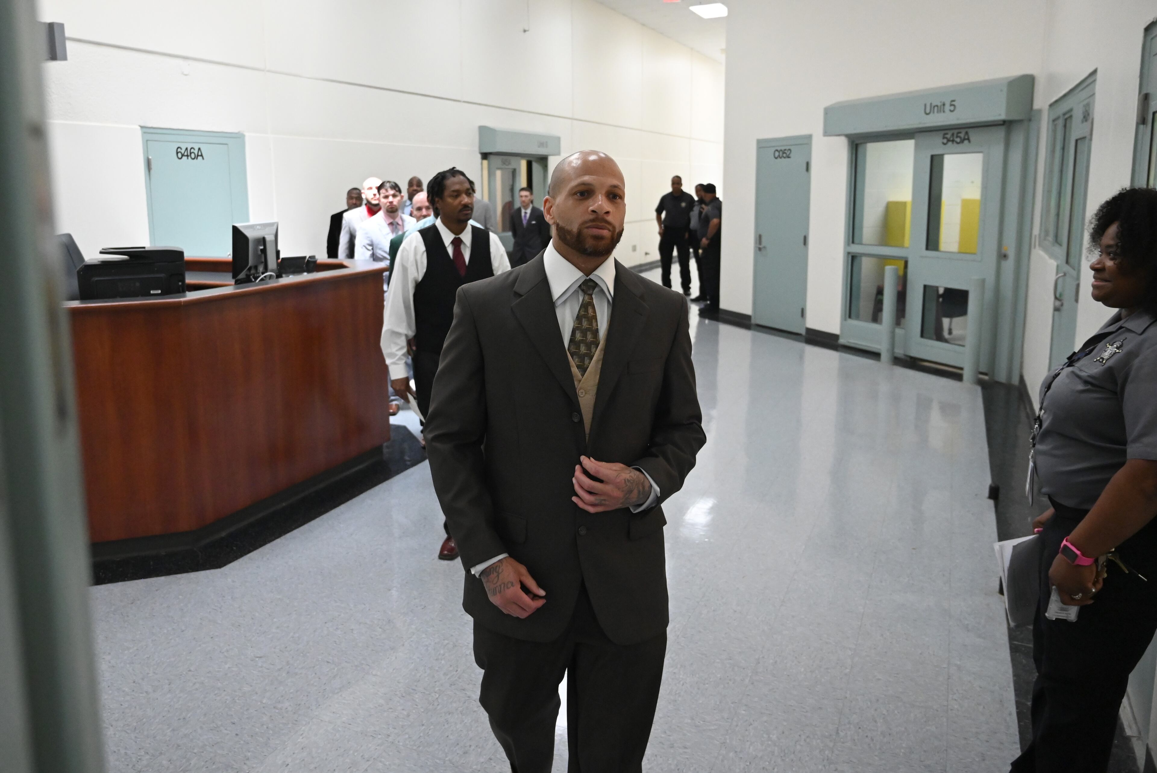 Program graduates, including Donovan Mallard (foreground), enter for their graduation ceremony for the Re-Entry Success Program at the Athens-Clarke County Jail on Wednesday, June 18, 2025, in Athens. (Hyosub Shin/AJC)