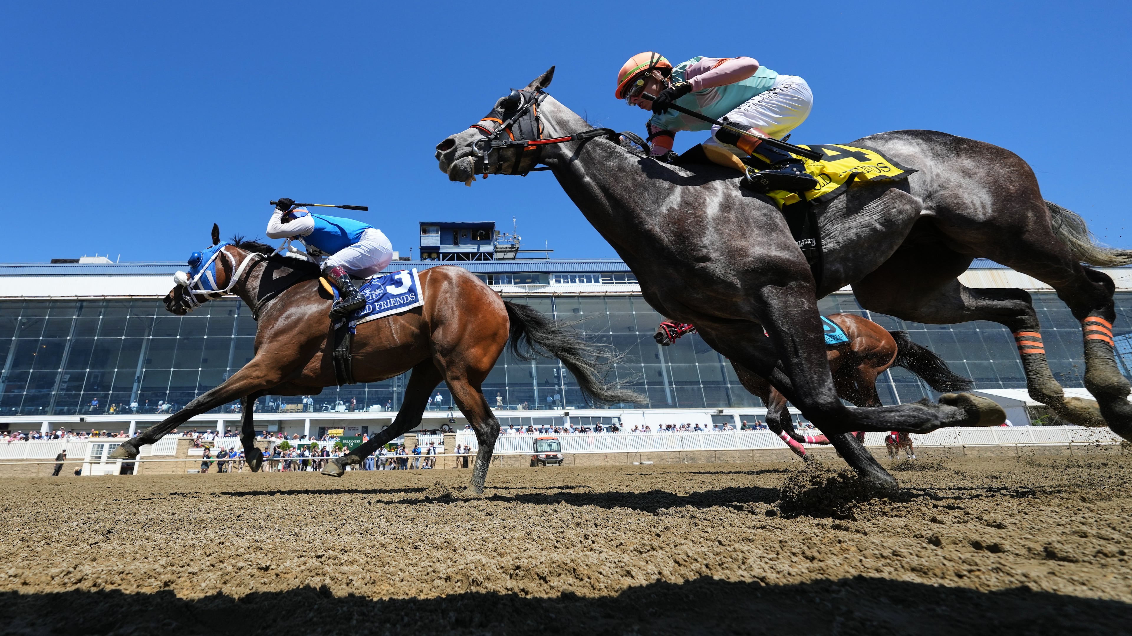 Jeiron Barbosa, left, atop Wickeddivine, edges out Irad Ortiz Jr., right, atop Freeze the Fire, to win an undercard race ahead of the 151st running of the Preakness Stakes horse race, Saturday, May 16, 2026, at Laurel Park in Laurel, Md. (AP Photo/Julia Demaree Nikhinson)