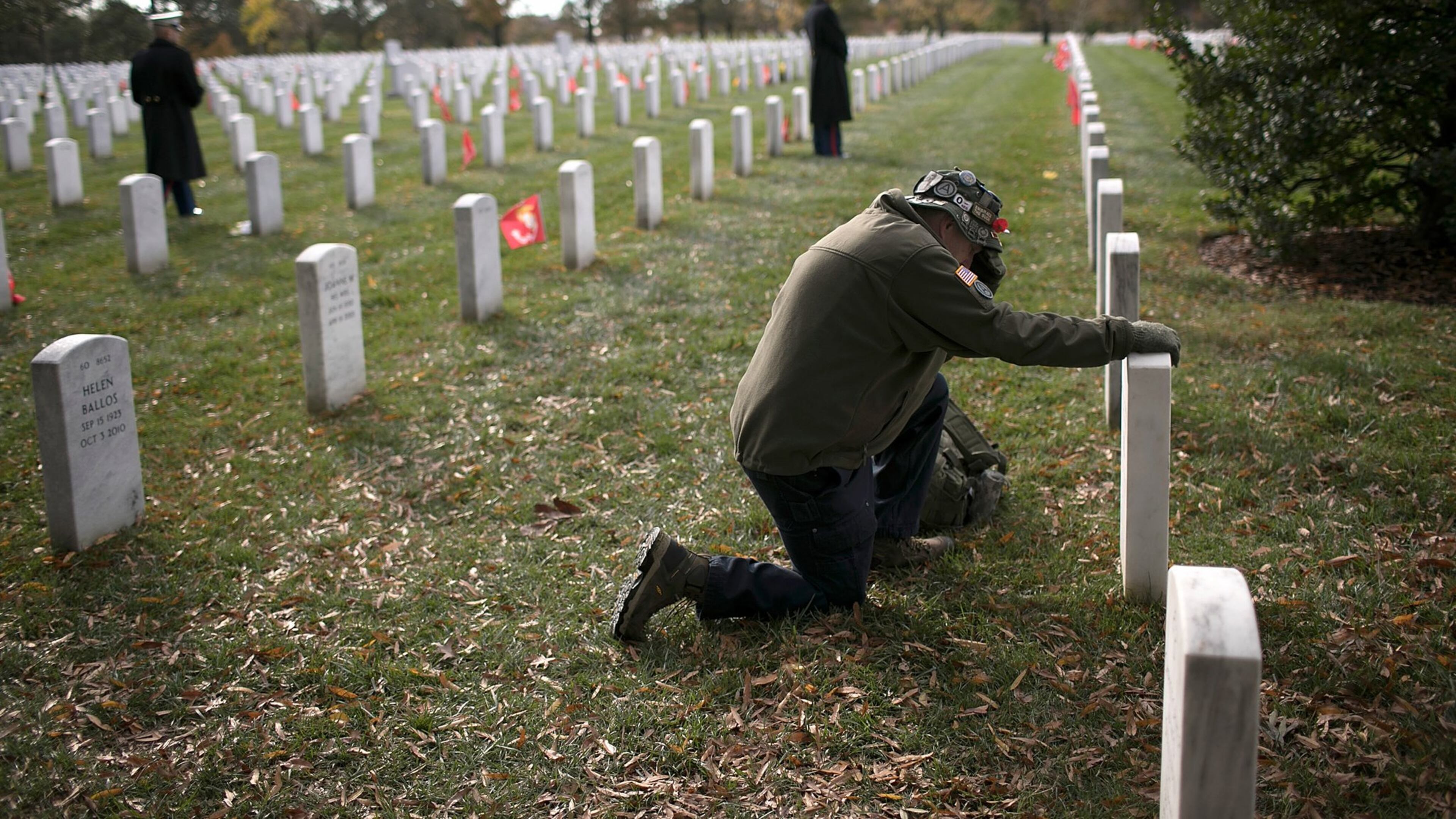 ARLINGTON, VA - Gulf War veteran John Schoon visits the gravesite of U.S.M.C. Sgt Christopher Hrbek one day before Veterans Day at Arlington National Cemetery on Friday, Nov. 10. Veterans Day, observed on November 11, honors all members of the U.S. military who served in the United States Armed Forces. WIN MCNAMEE/GETTY IMAGES