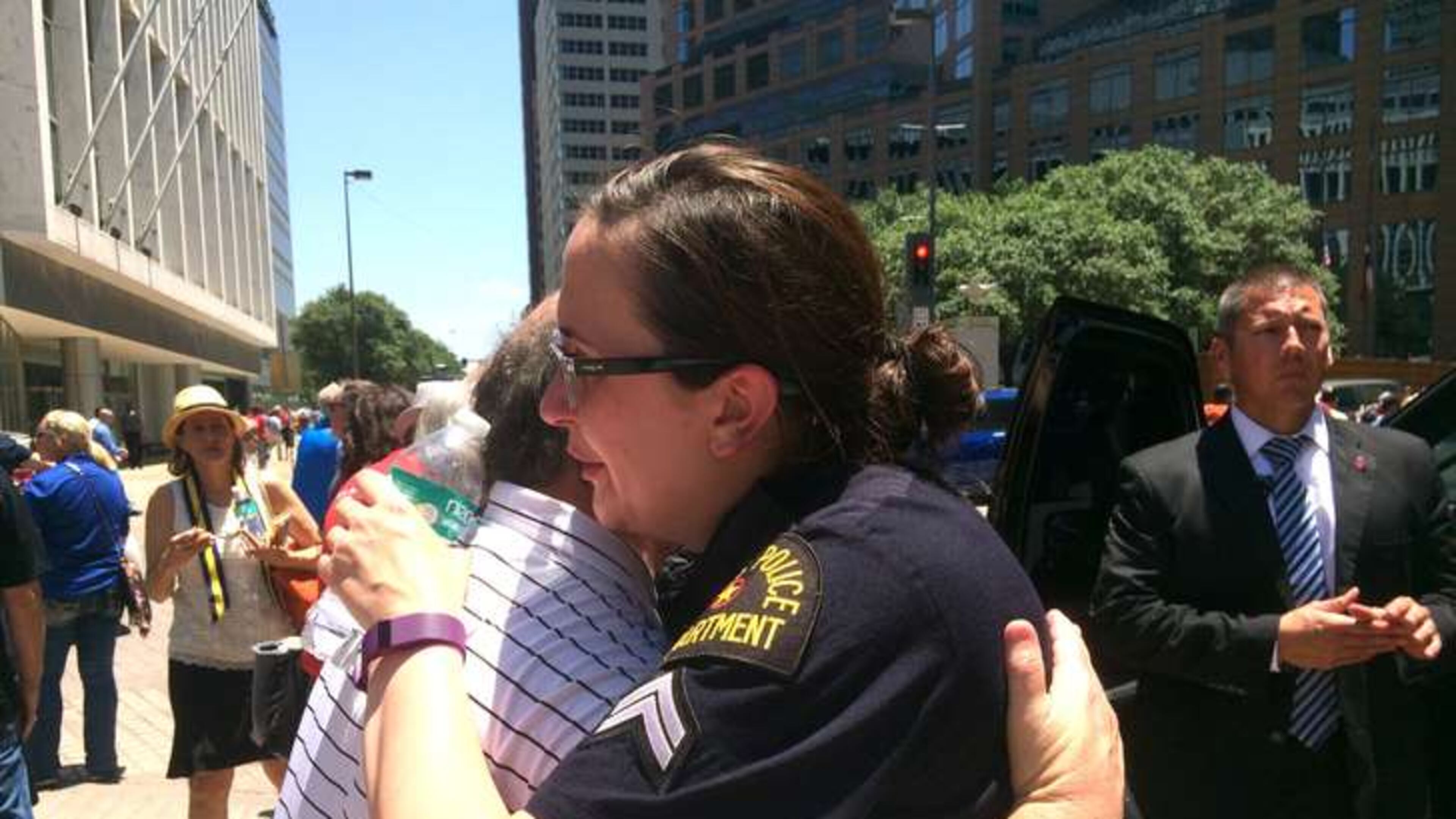 Dallas Police Senior Cpl. Debra Webb hugs a resident after a prayer service in downtown Dallas Friday afternoon. Photo: Jennifer Brett, jbrett@ajc.com