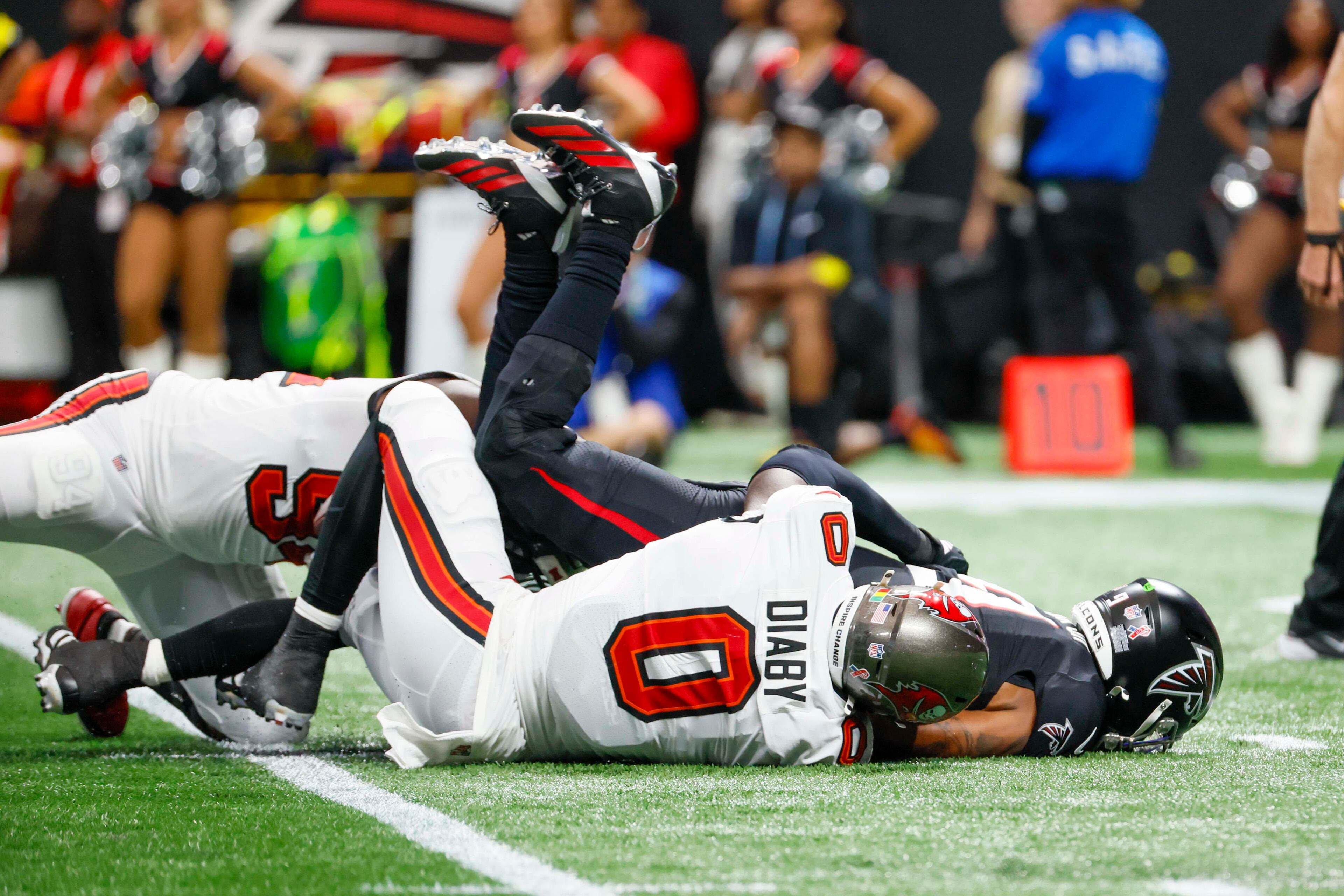 Atlanta Falcons quarterback Michael Penix Jr. (9) hits the ground after a sack from Tampa Bay Buccaneers linebacker Yaya Diaby (0) during the second half of an NFL game against the Tampa Bay Buccaneers at Mercedes-Benz Stadium on Sunday, September 7, 2025, in Atlanta.
(Miguel Martinez/ AJC)