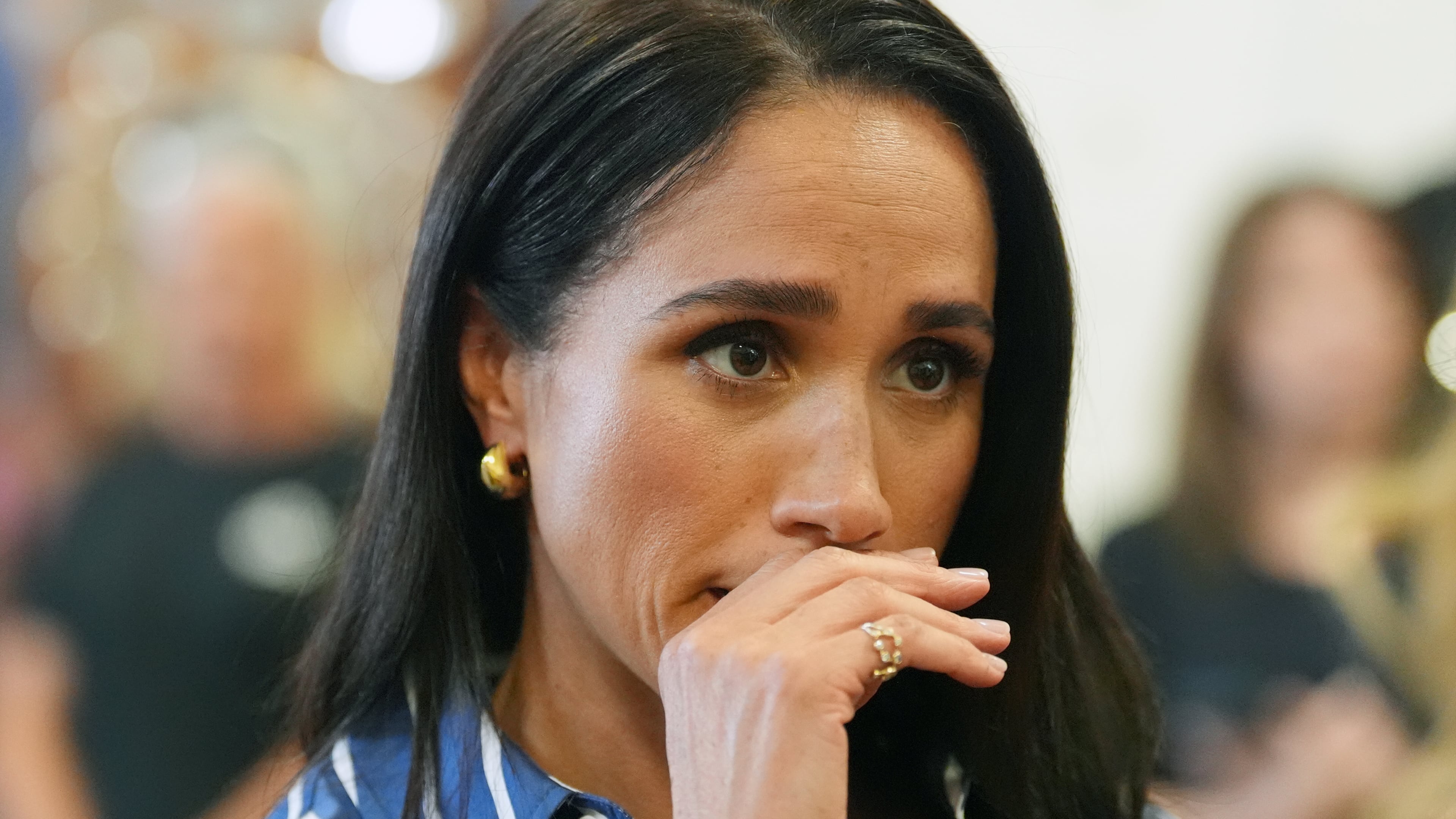 FILE- Meghan Markle, the Duchess of Sussex, meets volunteer first responders from the Bondi Surf Bathers' Life Saving Club during a visit to Bondi Beach, Australia, on April 17, 2026. (Jonathan Brady/Pool Photo via AP, File)