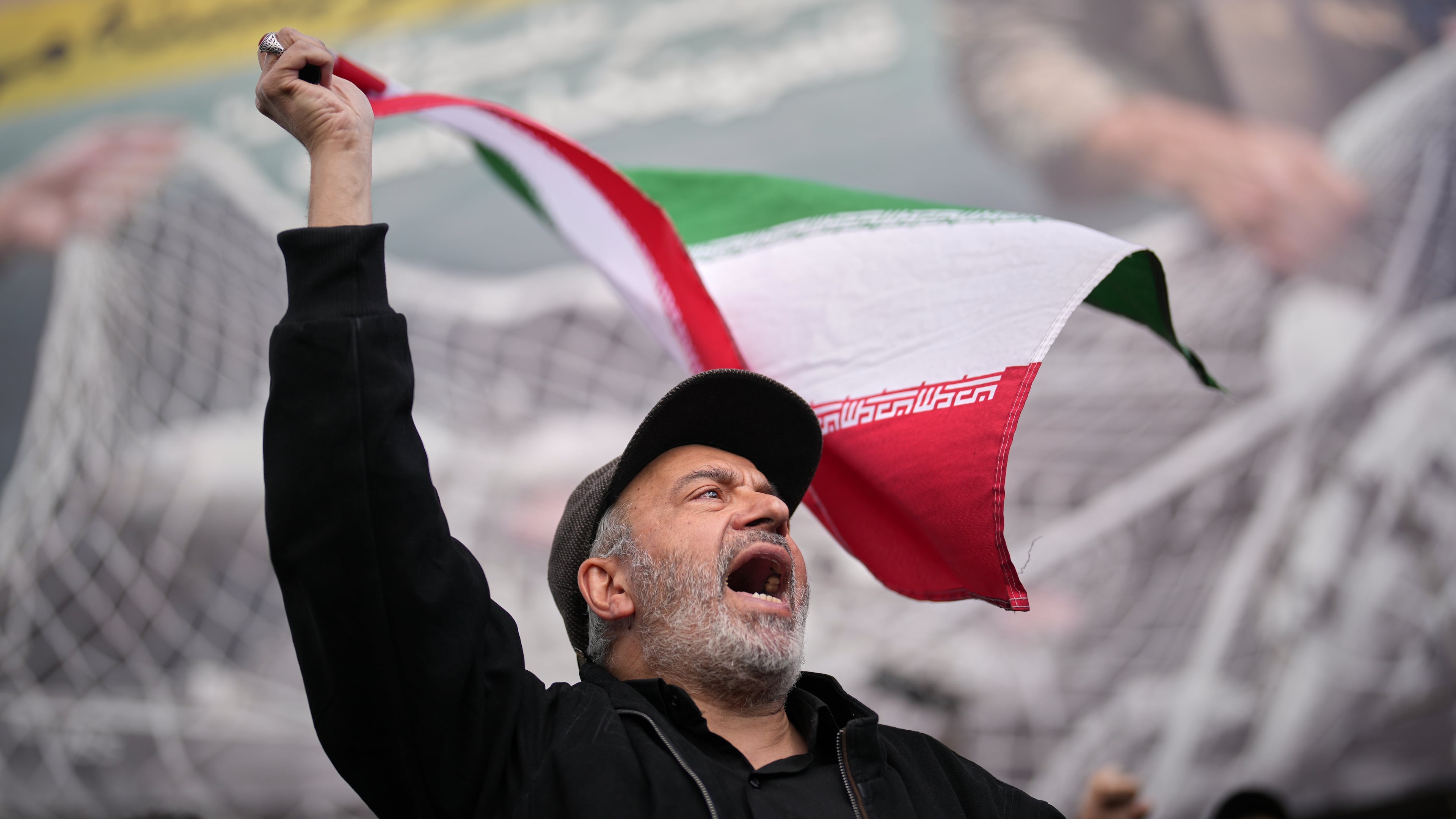 A government supporter chants slogans during a gathering after the announcement of a two-week ceasefire with the United States and Israel in Tehran, Iran, Wednesday, April 8, 2026. (AP Photo/Francisco Seco)