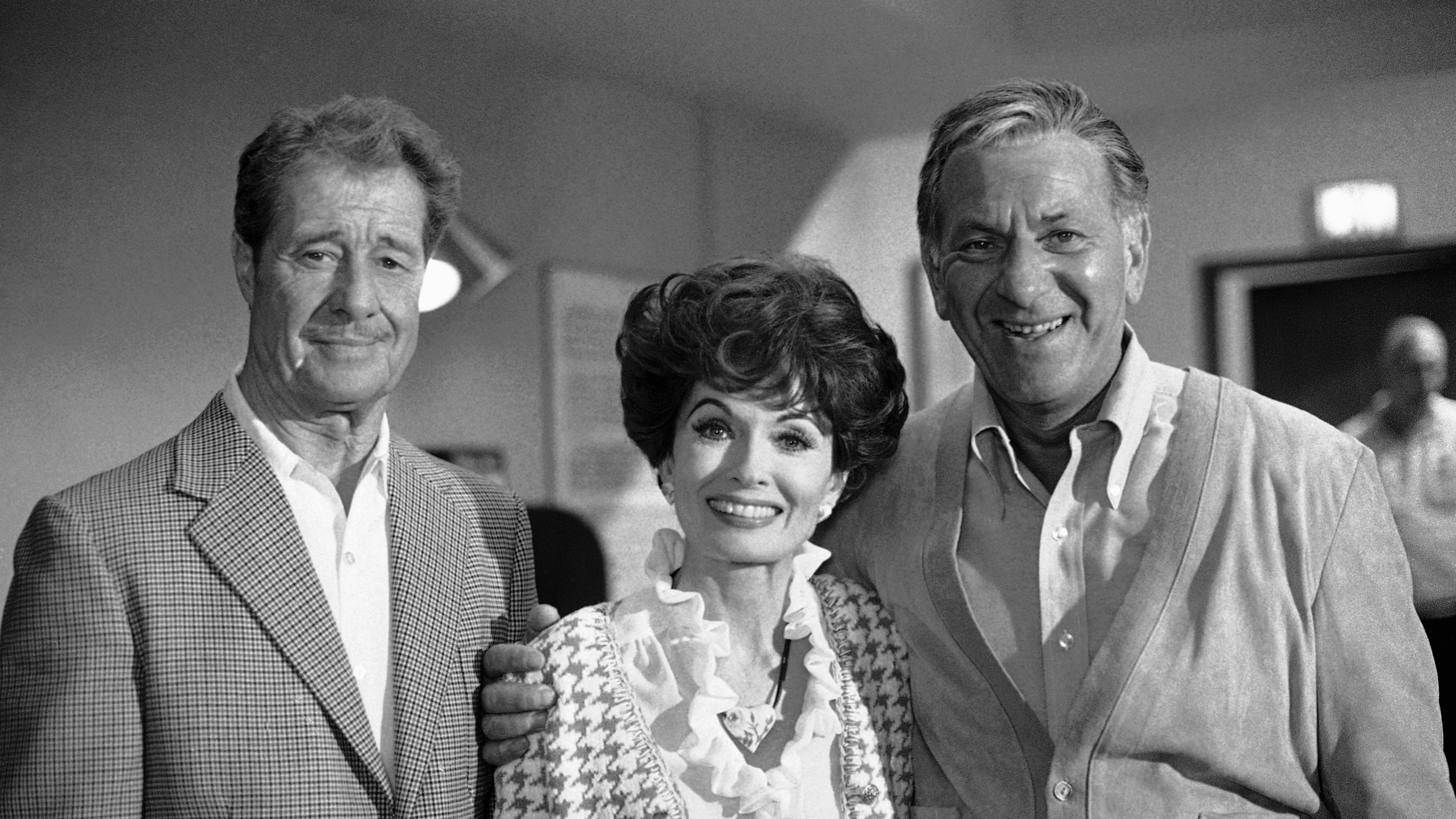 FILE - Don Ameche, left, and Ann Blyth, center, as guest stars, join Jack Klugman on the set for an episode of the television series, Quincy, June 22, 1978, Los Angeles, Calif. (AP Photo/Nick Ut, File)