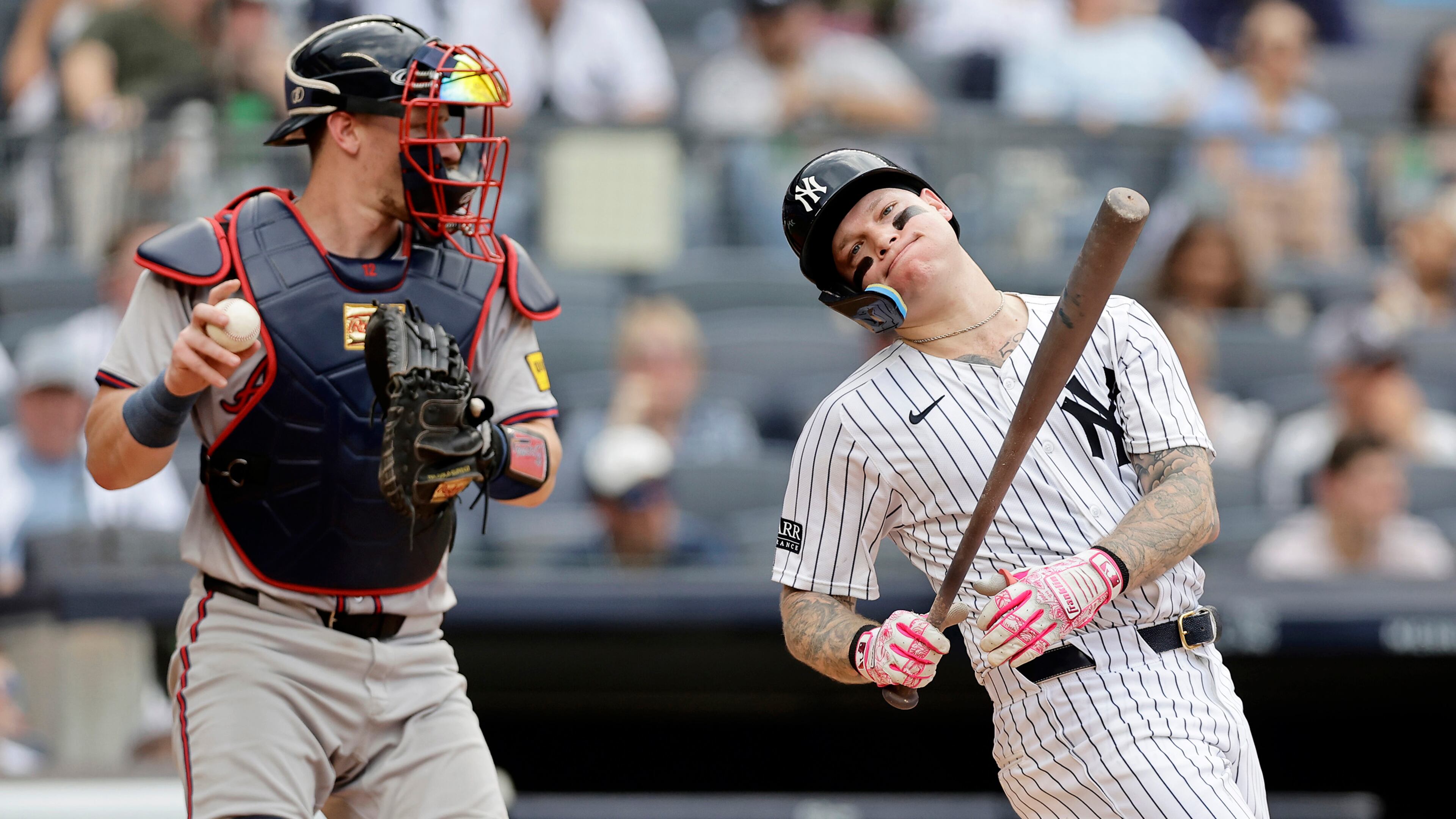 Sean Murphy (12) of the Atlanta Braves holds the ball as Alex Verdugo (24) of the New York Yankees reacts after striking out to end the fourth inning at Yankee Stadium on Sunday, June 23, 2024, in New York City. (Jim McIsaac/Getty Images/TNS)