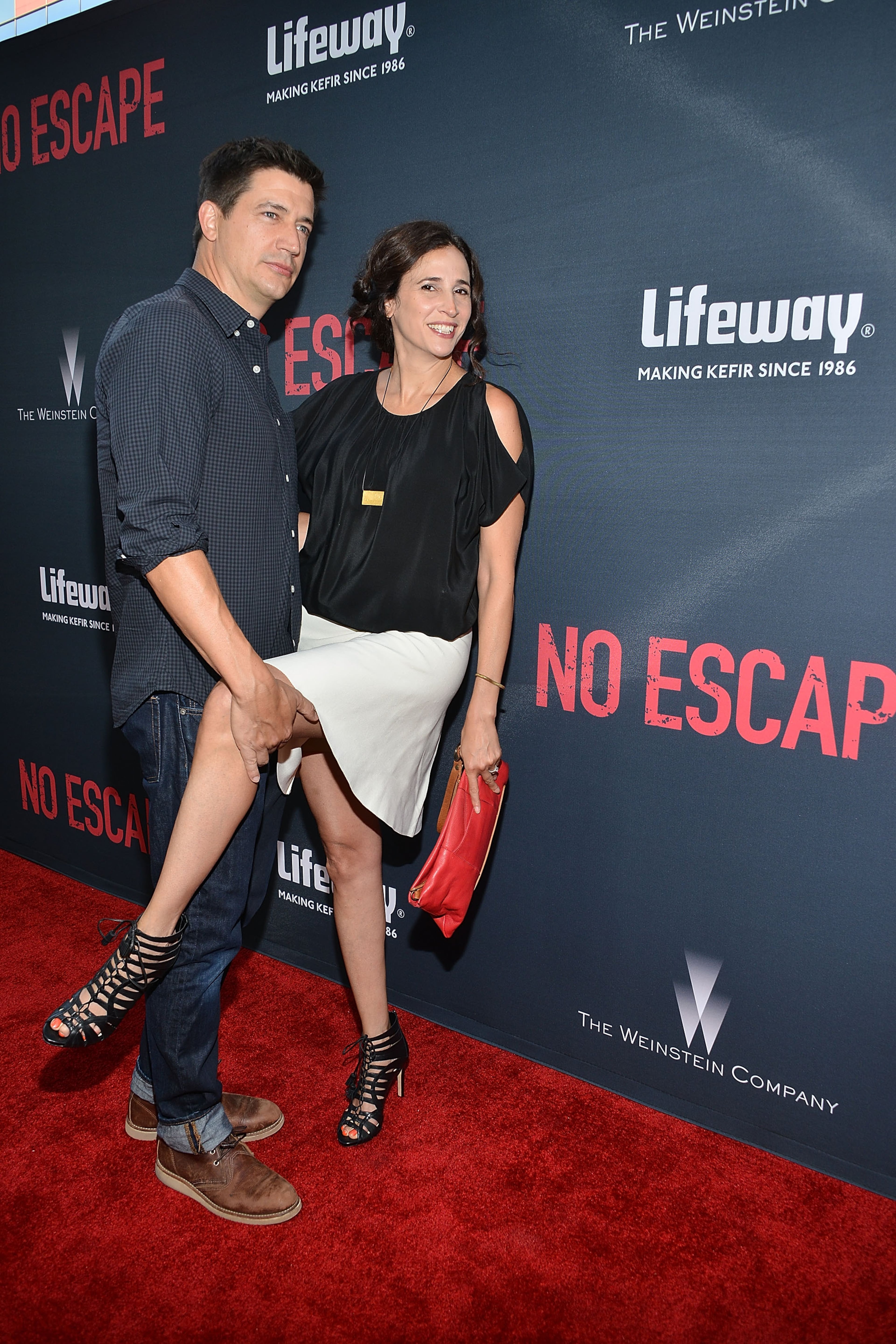 LOS ANGELES, CA - AUGUST 17: Ken Marino and Michaela Watkins attend the premiere of the Weinstein Company's 'No Escape' at Regal Cinemas L.A. Live on August 17, 2015 in Los Angeles, California. (Photo by Araya Diaz/Getty Images for The Weinstein Company)
