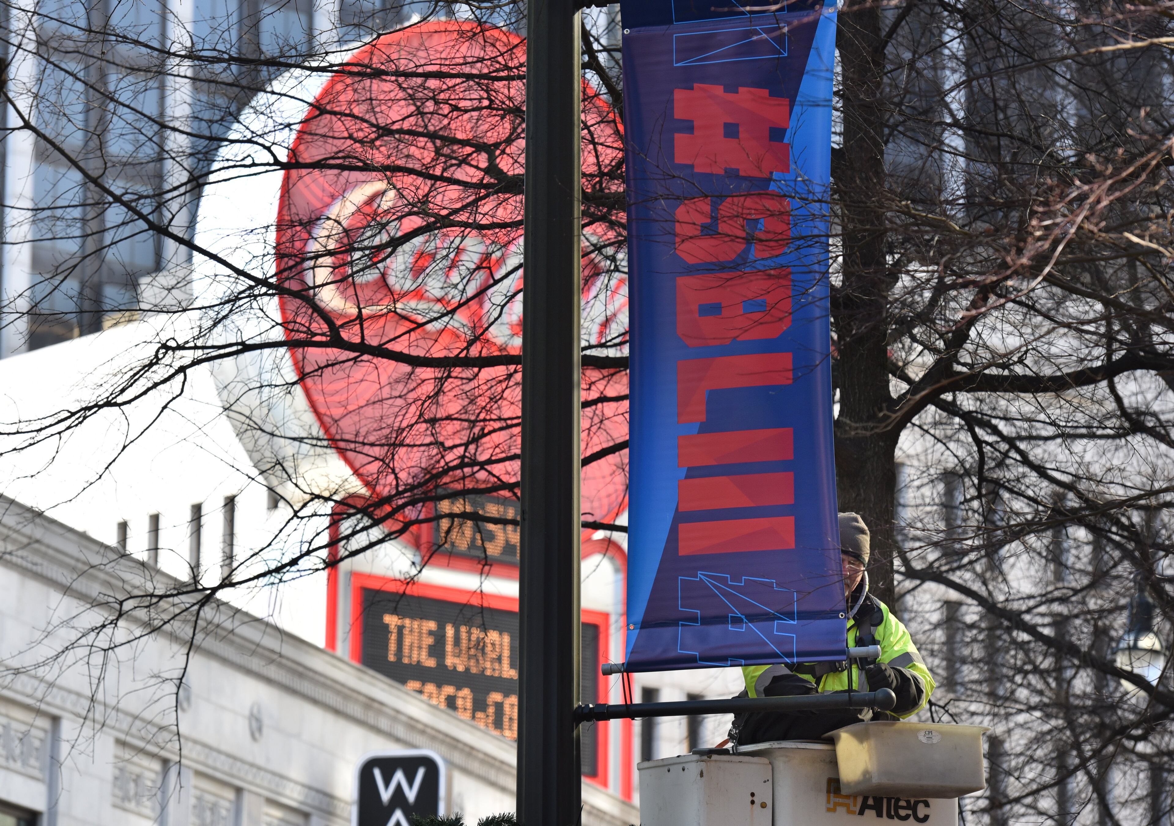 January 16, 2019 Atlanta - Keith Bentley, contractor, installs Super Bowl LIII banners near Woodruff Park in downtown Atlanta on Wednesday, January 16, 2019. Atlanta faces a test on Super Bowl Sunday and the question with less than a month to go before the big game is this: Is the city ready? The city budgeted some $10 million last year for police, fire and other items to assist with the big game. HYOSUB SHIN / HSHIN@AJC.COM