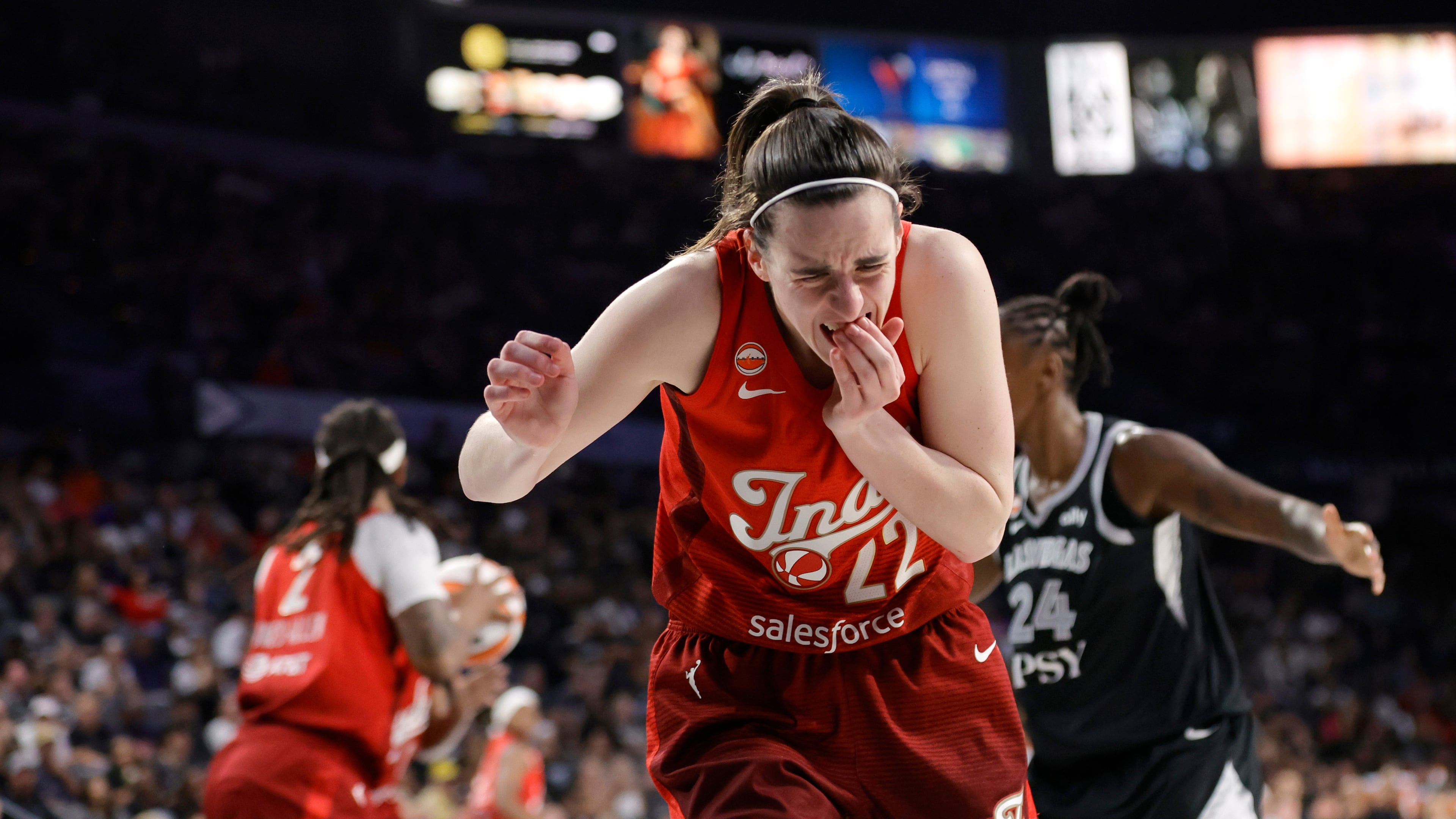 Indiana Fever guard Caitlin Clark (22) reacts after being hurt on a play during the second half in Game 3 of an WNBA basketball first-round playoff series against the Las Vegas Aces, Thursday, Oct. 1, 2026, in Las Vegas. (AP Photo/Steve Marcus)