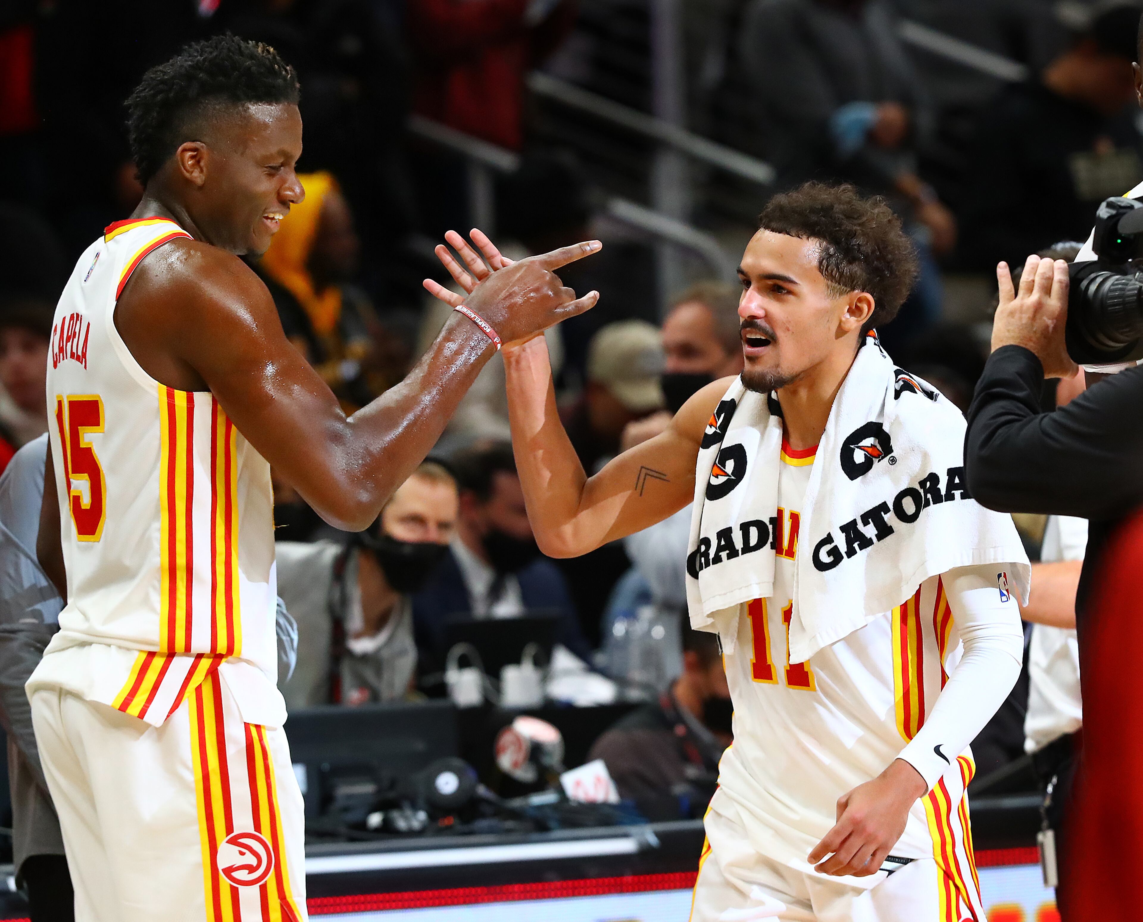 Hawks center Clint Capela (left), who had a double-double, gets five from guard Trae Young after beating the Oklahoma City Thunder 113-101 in a NBA basketball game on Monday, Nov. 22, 2021, in Atlanta. “Curtis Compton / Curtis.Compton@ajc.com”