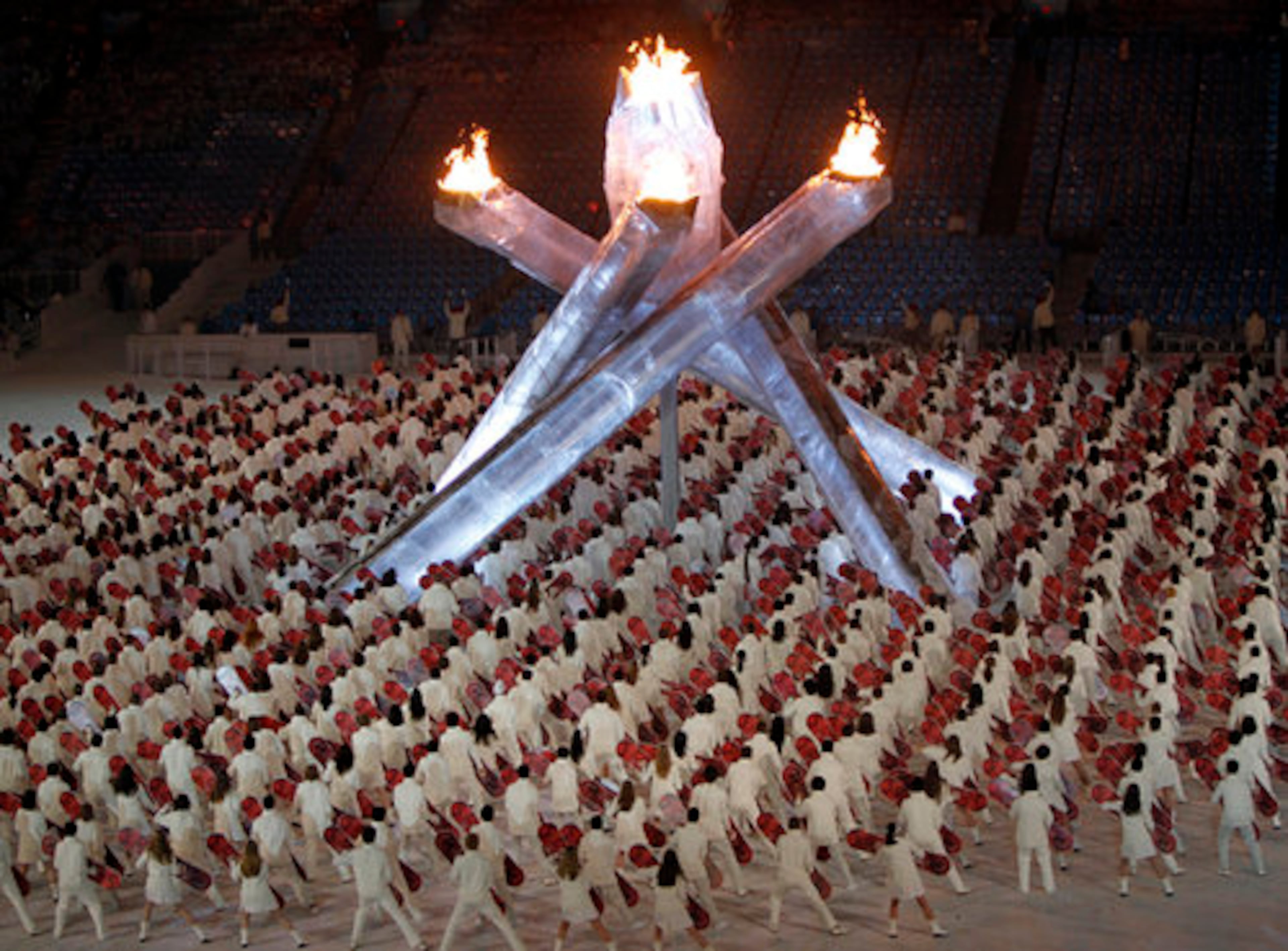 Performers dance around the cauldron during the closing ceremony.
