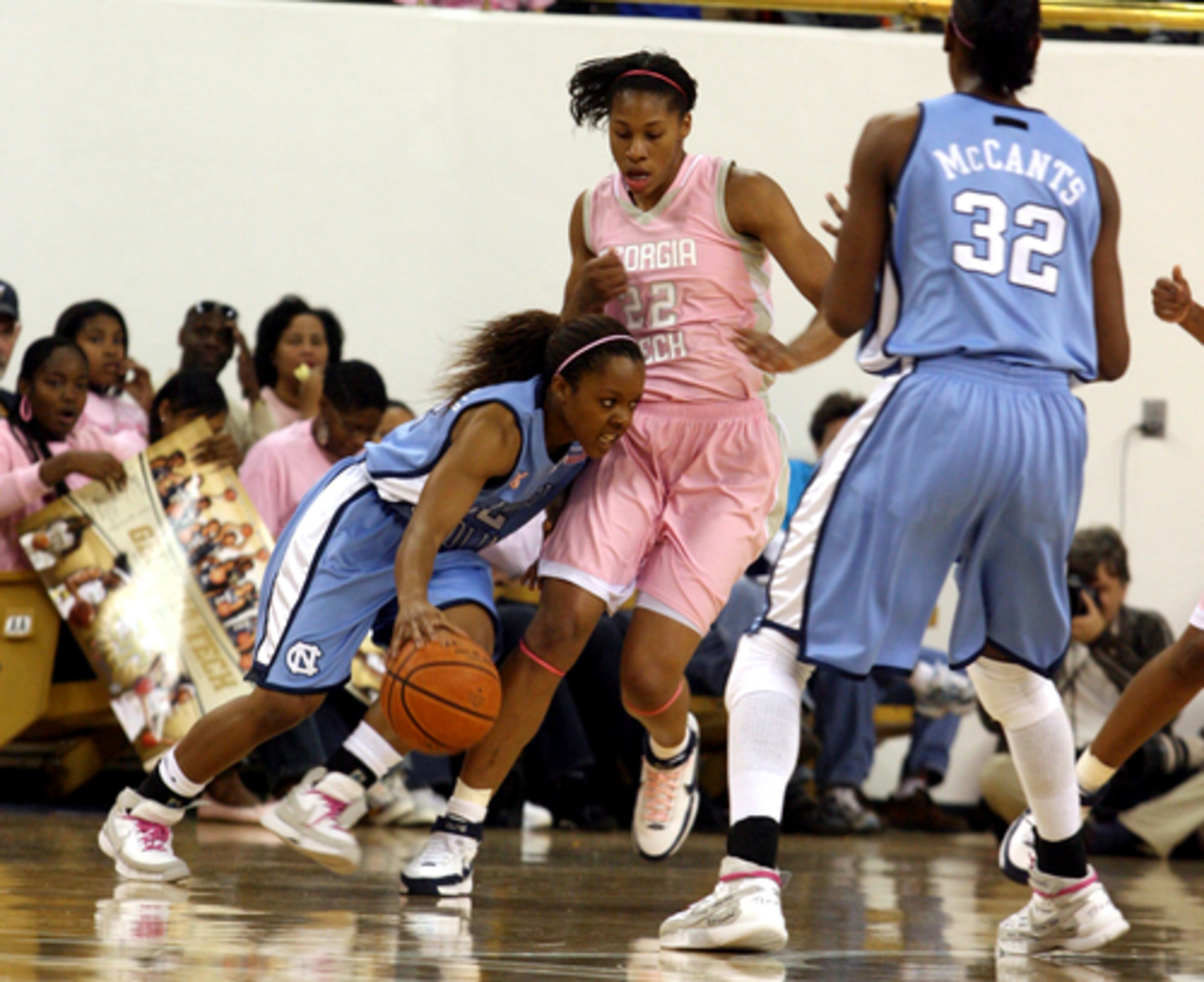 North Carolina's Cetera DeGraffenreid (left) plows into Tech's Alex Montgomery.