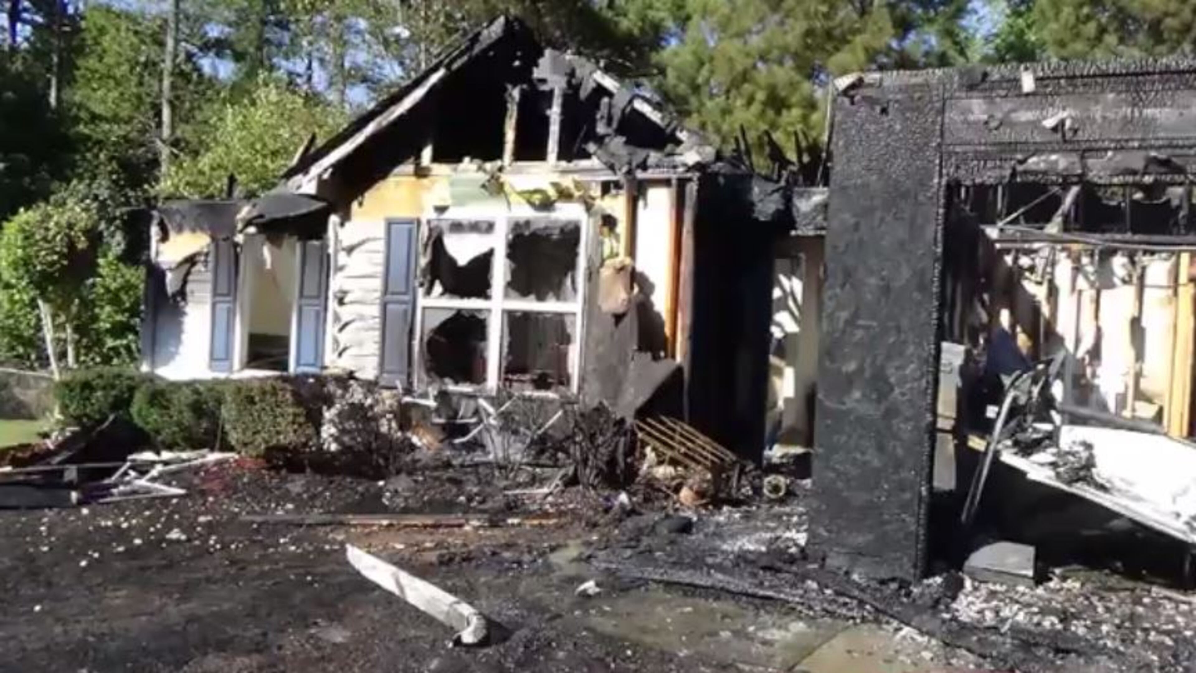 A man, woman and infant escaped a Thursday afternoon fire that destroyed their home on Shelby Lane near Buford. (Credit: Gwinnett County fire)