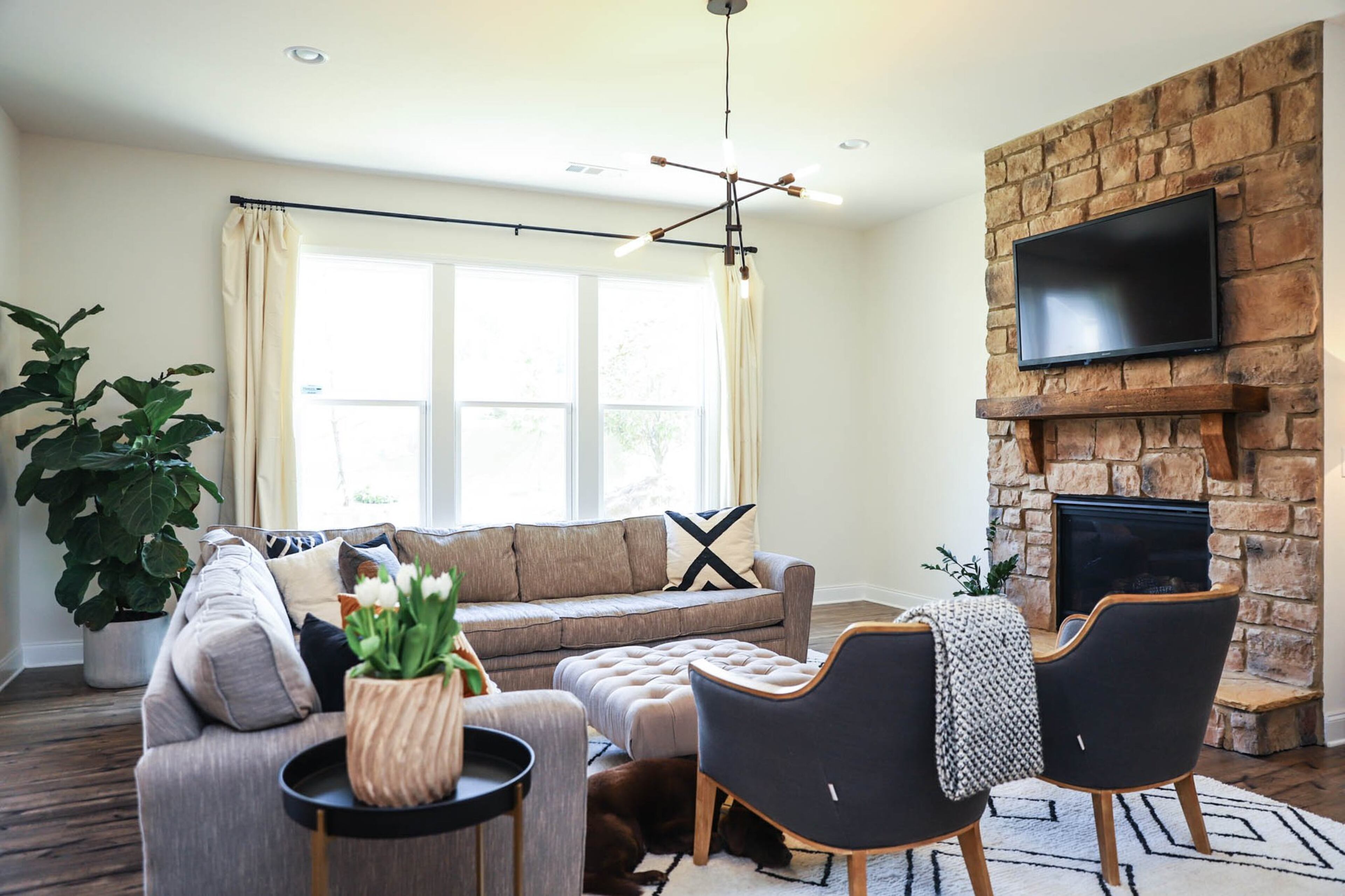 Furnished with a sectional sofa and chairs that they brought with them from their previous home in Oklahoma, Shelly and David McIntosh’s living room is where they spend most of their time as a family. The McIntoshes built their home with Pulte Homes earler this year. Text by Shannon Dominy. Photo by Reynolds Rogers.