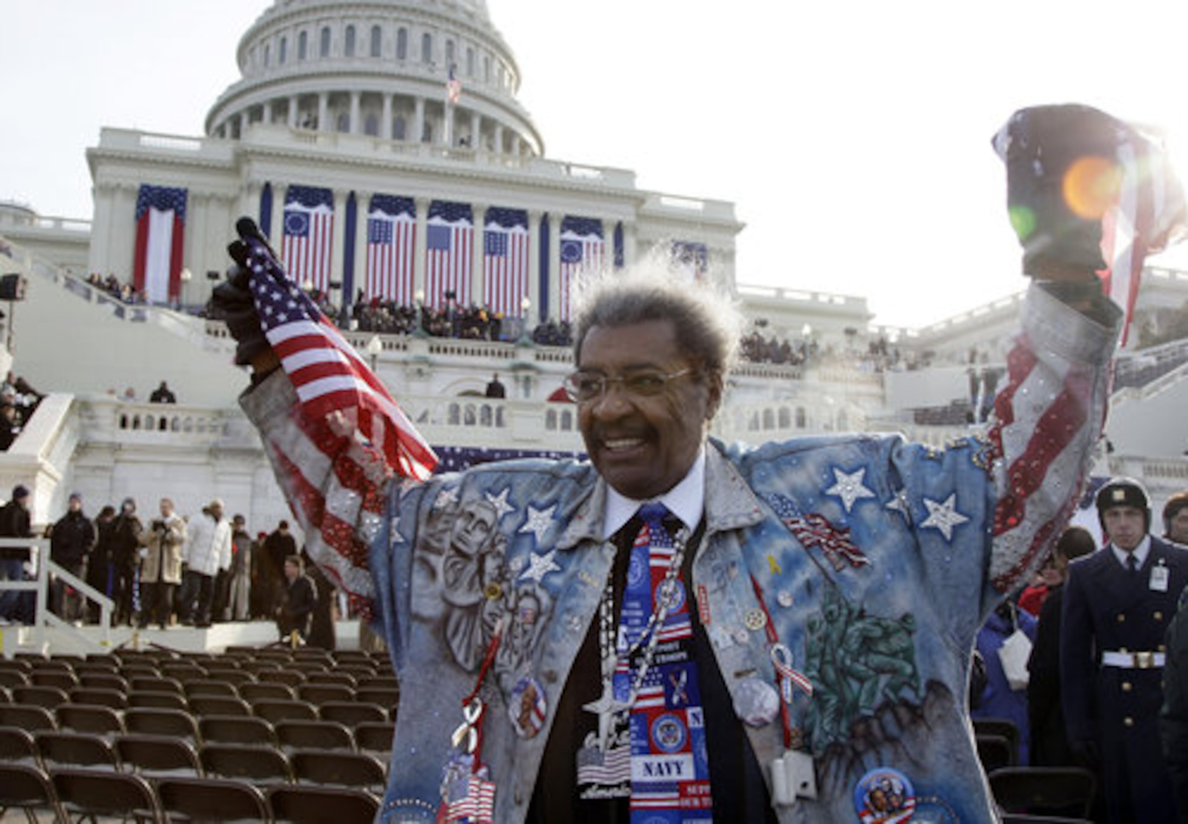 Bxoning promoter Don King holds up his flags before the inauguration ceremony at the U.S. Capitol.