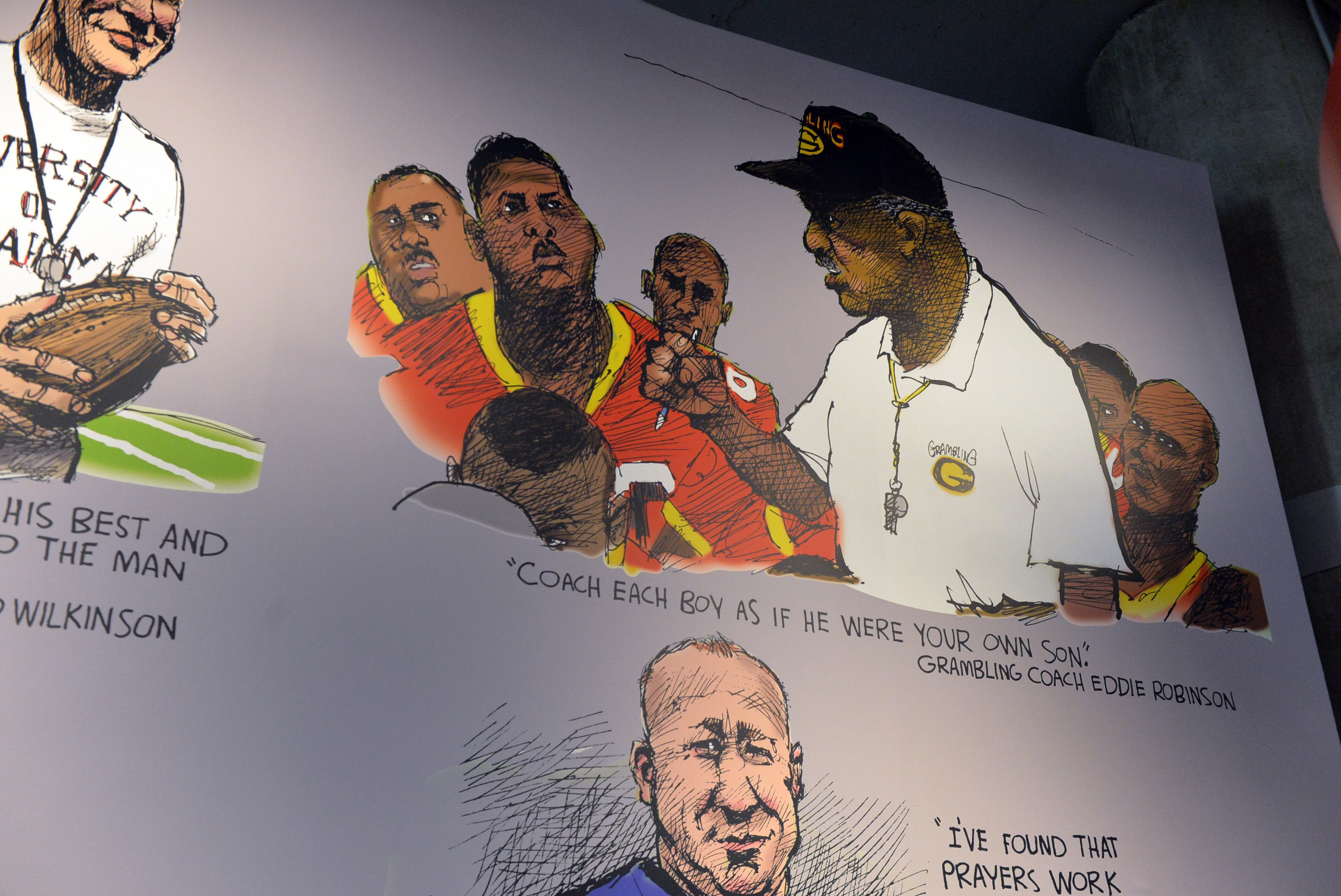 A mural by the AJC's Pulitzer Prize-winning cartoonist Mike Luckovich shows iconic coaches. Featured here is legendary Grambling coach Eddie Robinson.