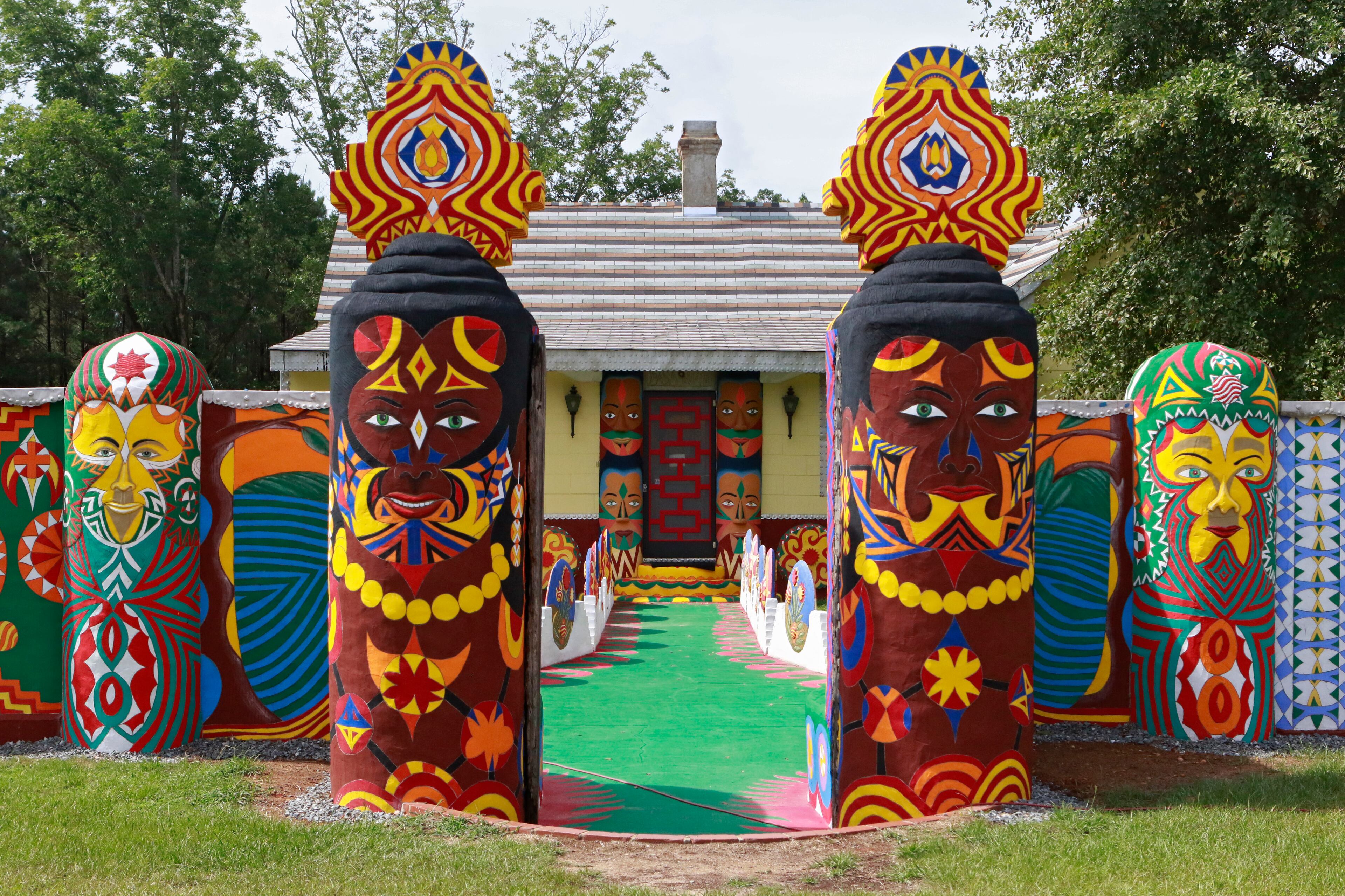 The vibrantly restored entrance to Pasaquan, with painted totems that appear throughout the site. Pasaquan is an art installation created by the late visionary artist Eddie Owens Martin in Buena Vista. (Bob Andres / bandres@ajc.com)