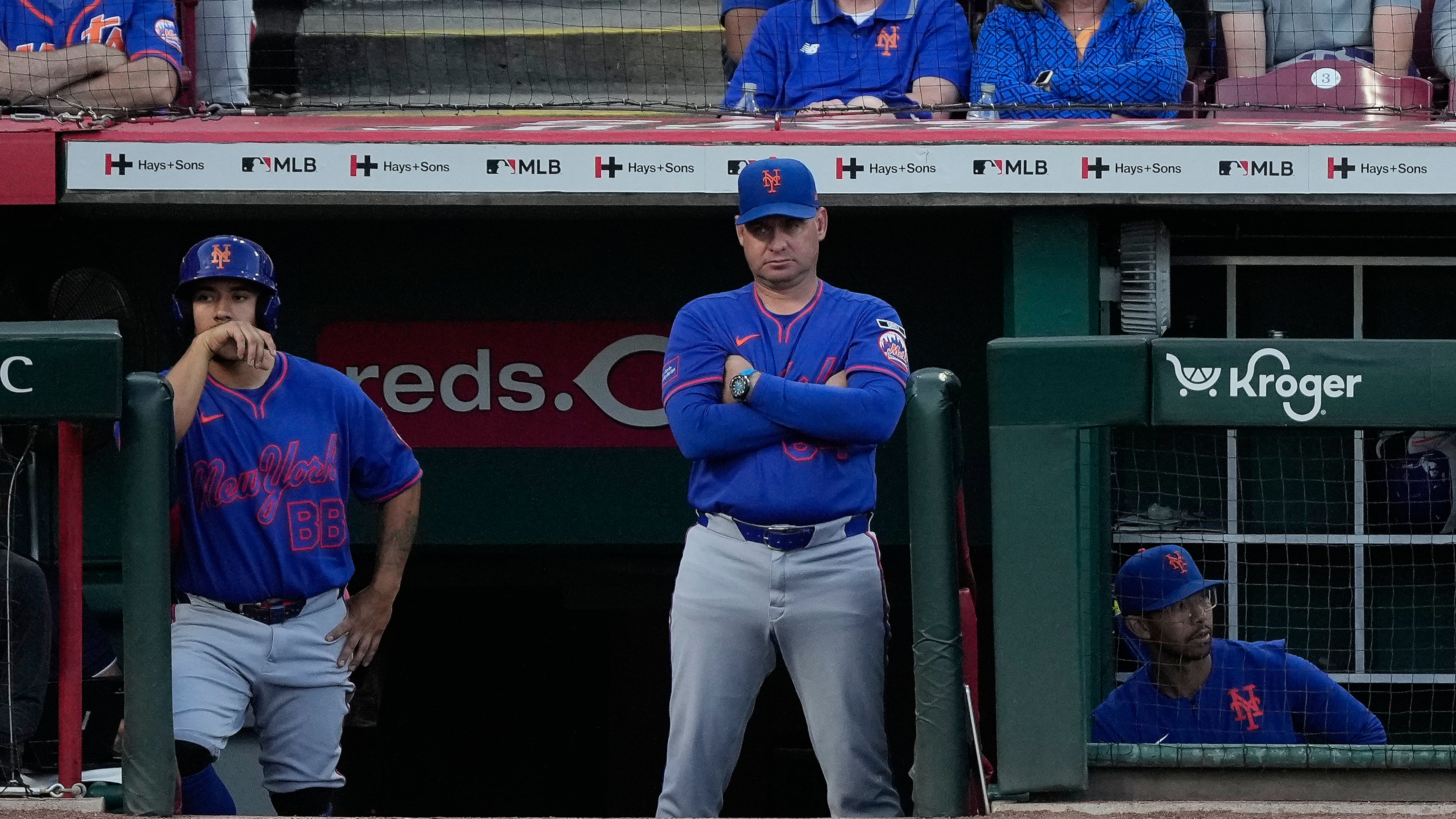 New York Mets manager Carlos Mendoza center, looks out from the dugout during the fourth inning of a baseball game against the Cincinnati Reds in Cincinnati, Monday, June 15, 2026. (AP Photo/Carolyn Kaster)