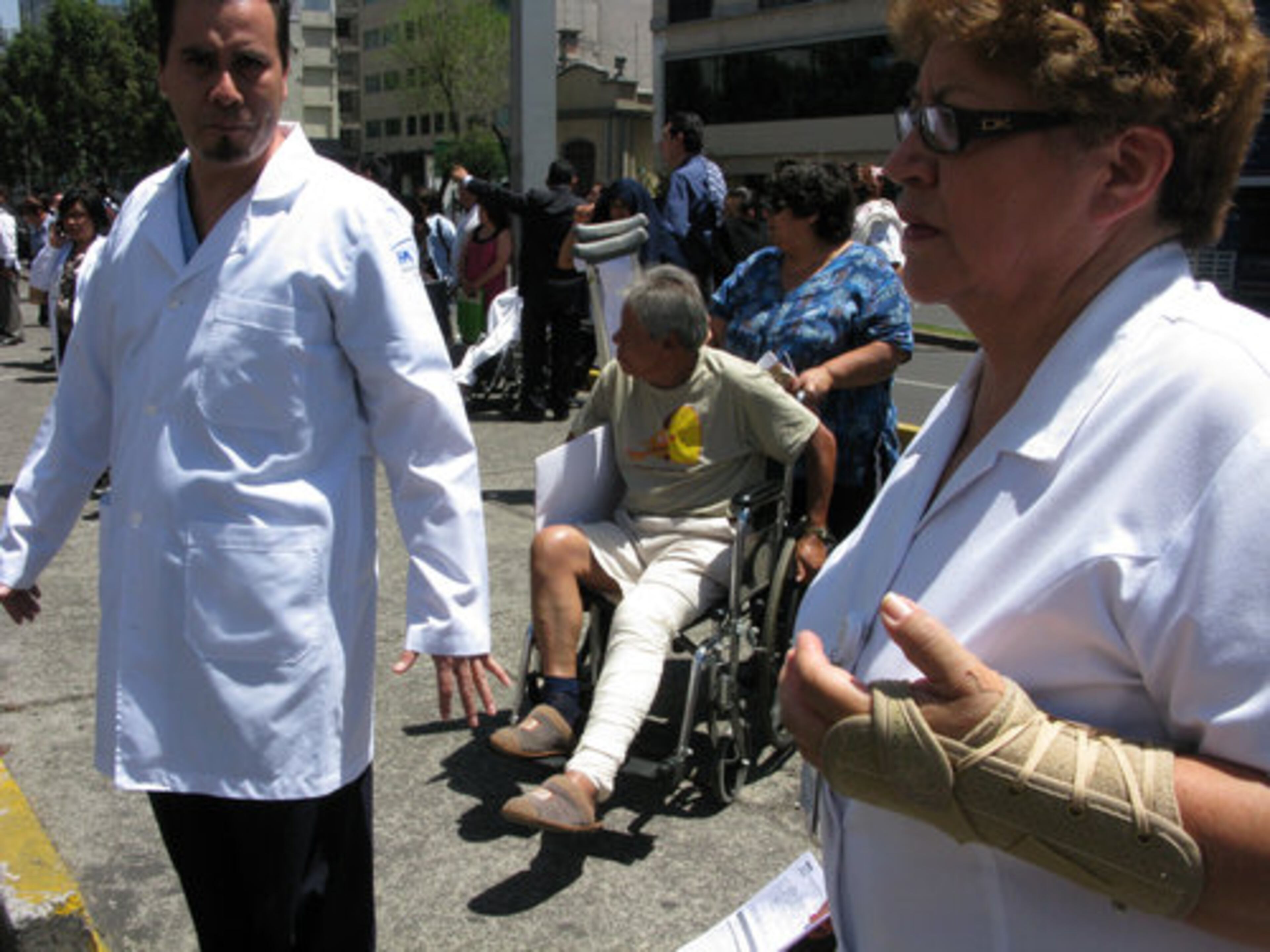 Patients are evacuated in wheelchairs from the Hospital de Chalpultepec after an earthquake was felt in Mexico City, Tuesday March 20, 2012.