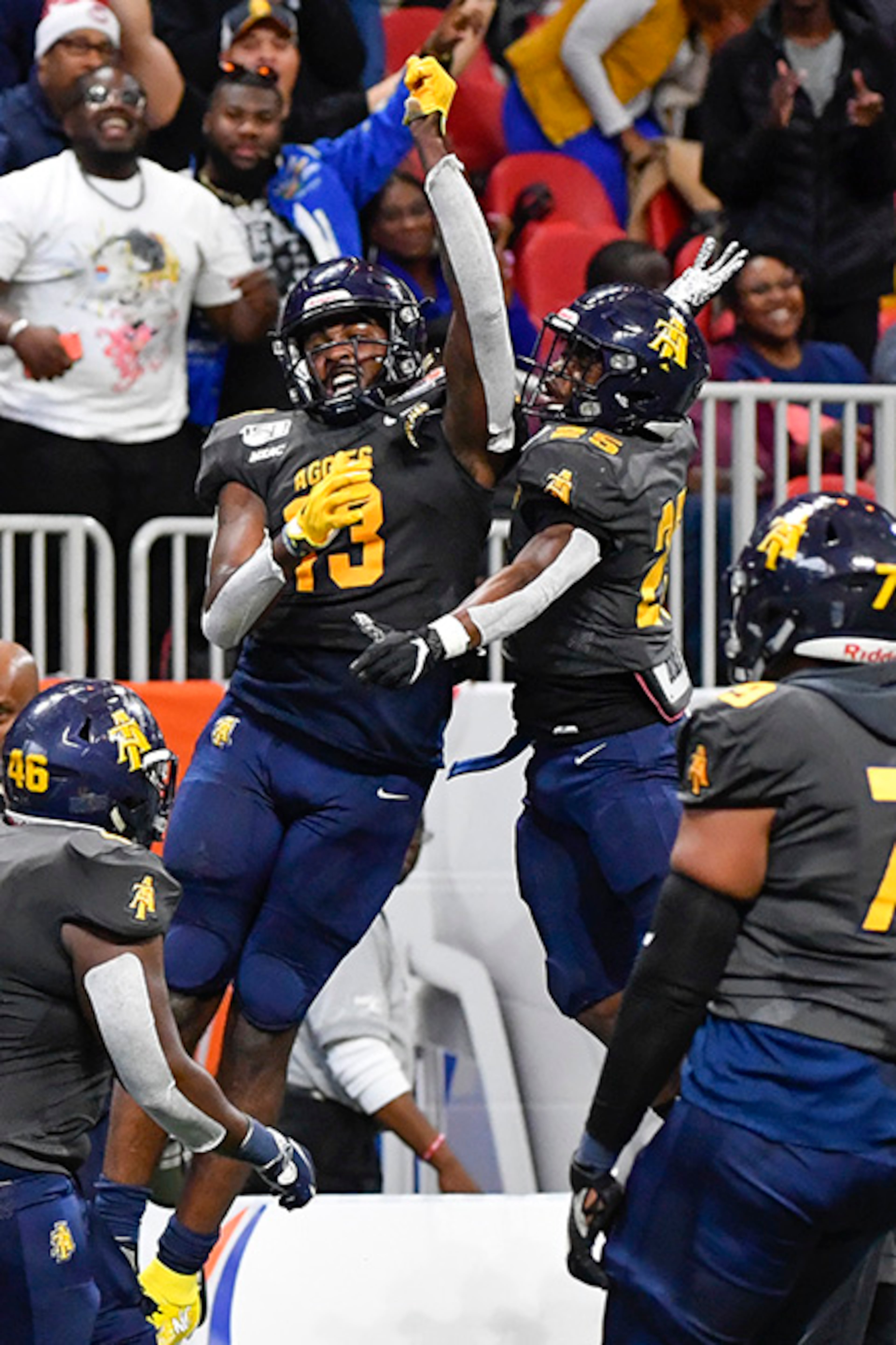 North Carolina A&T wide receiver Elijah Bell (13) and running back Kashon Baker (25) celebrate a touchdown against Alcorn State during the second half of the Celebration Bowl Saturday, Dec. 21, 2019, at Mercedes-Benz Stadium in Atlanta.