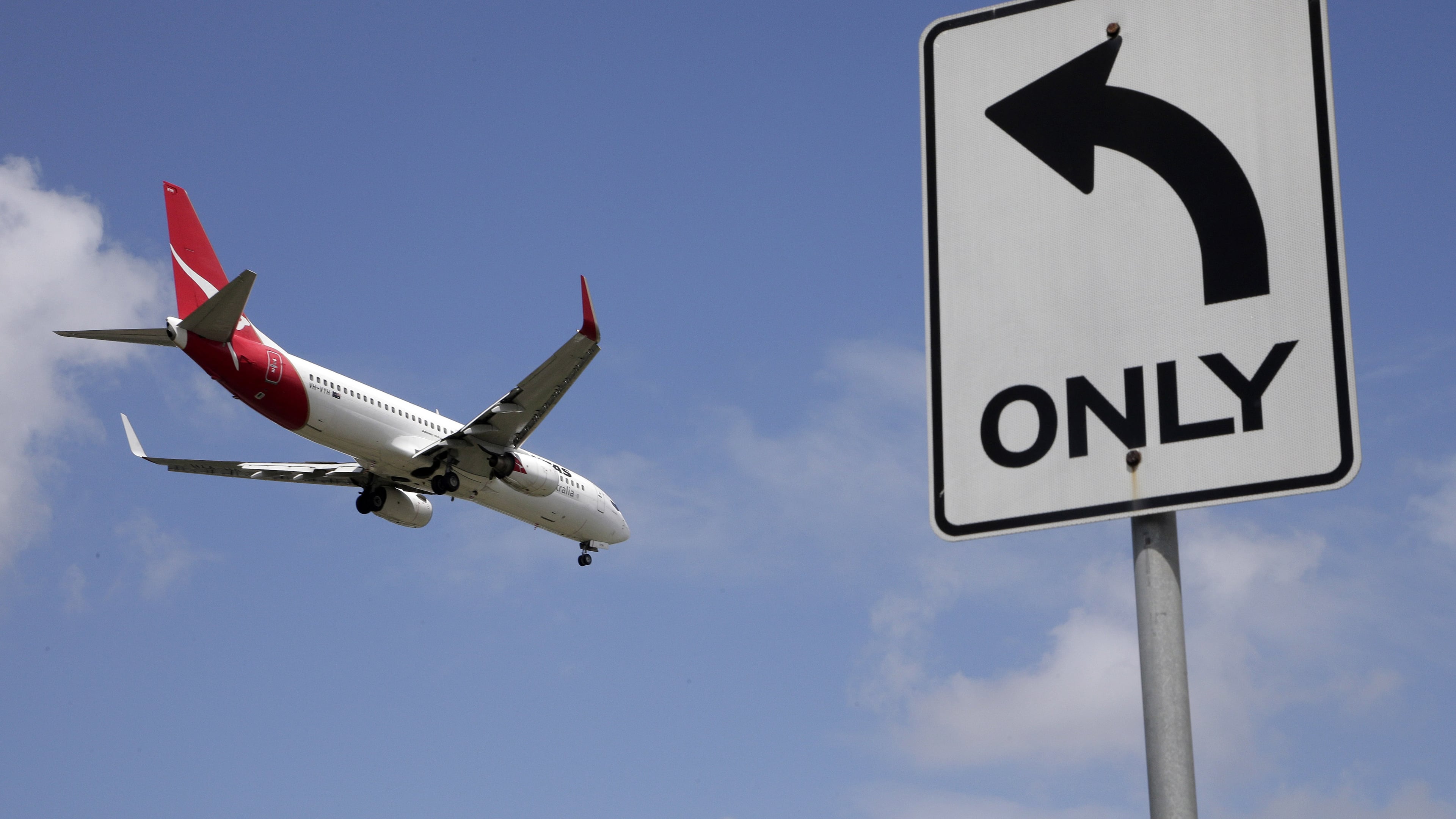 FILE - A Qantas plane prepares to land at Sydney Airport in Sydney, Australia, Feb. 21, 2013. (AP Photo/Rick Rycroft, File)