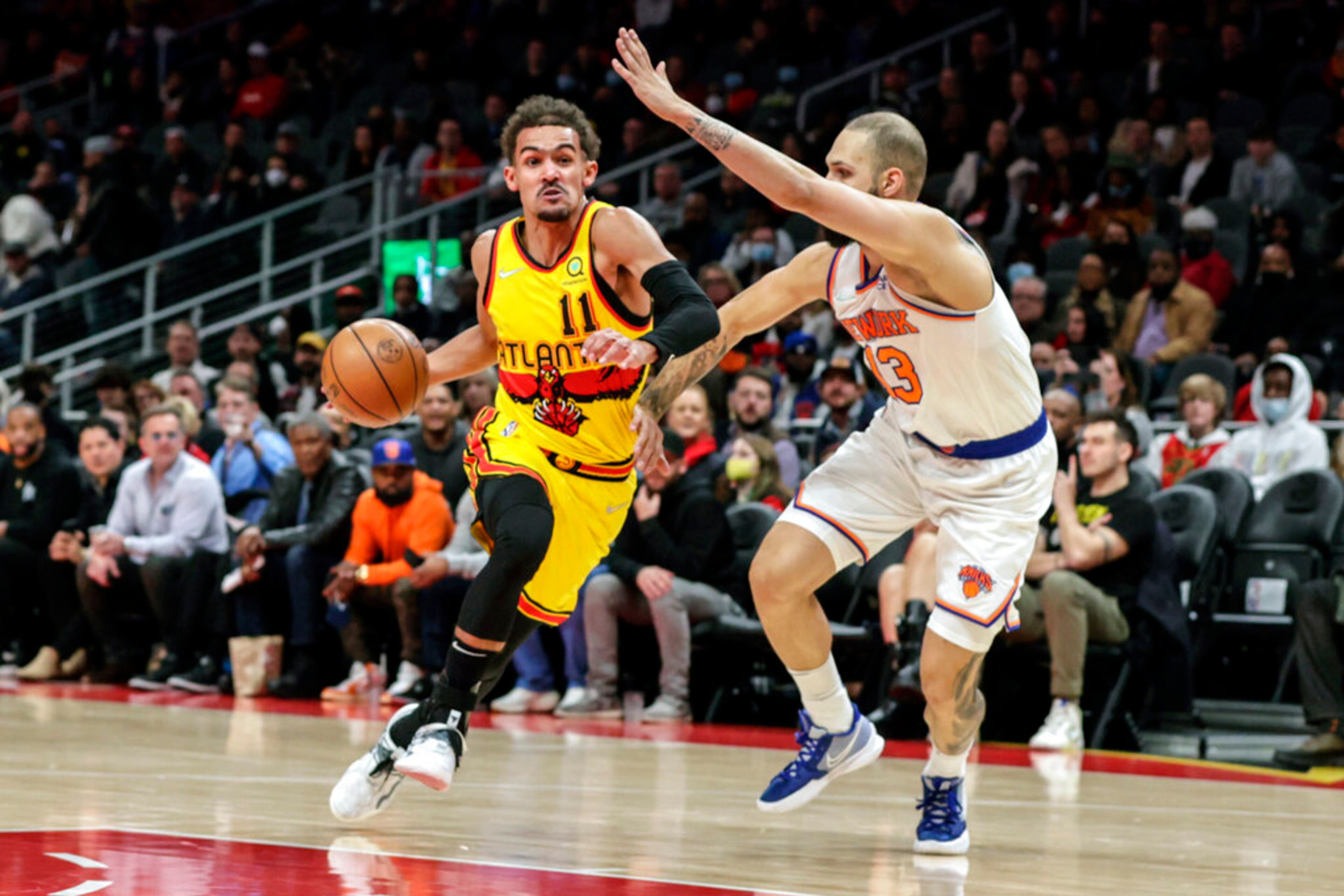 Atlanta Hawks guard Trae Young (11) drives to the basket as New York Knicks guard Evan Fournier (13) defends during the first half. (AP Photo/Butch Dill)