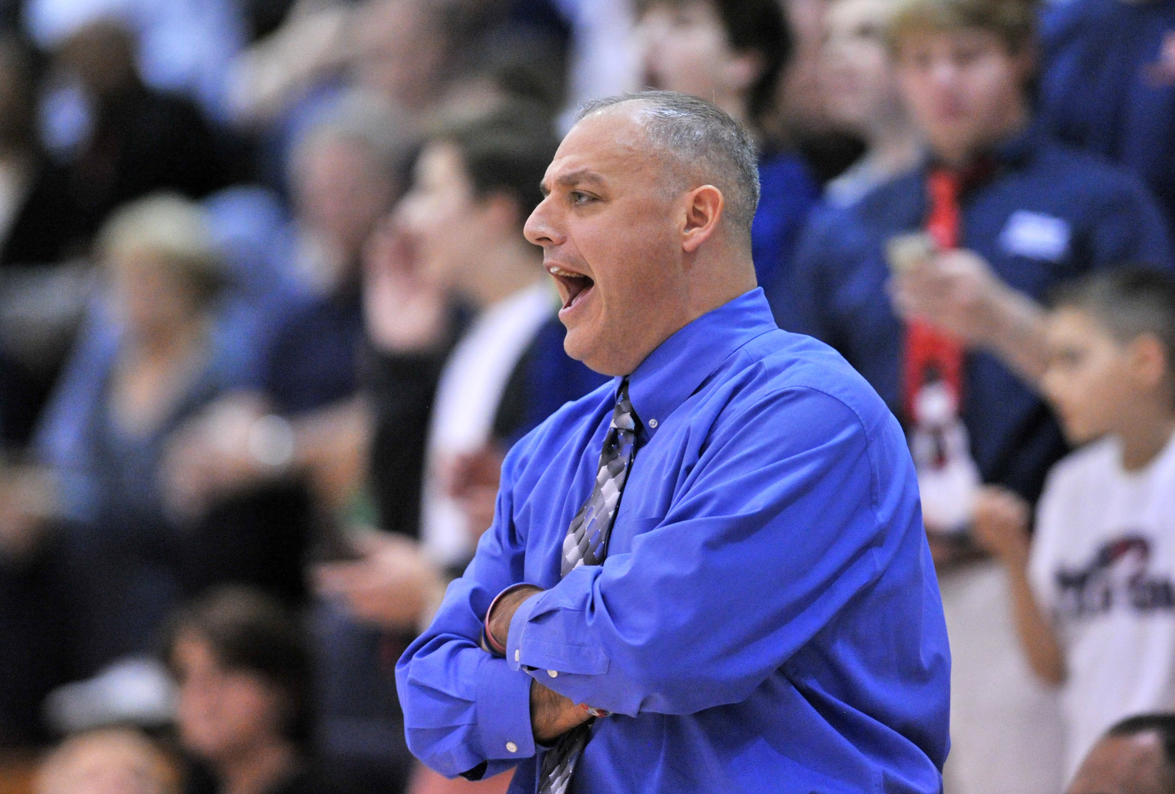 Milton' head coach Matt Kramer shouts instructions in the first half of 1st Round of State AAAAAA Playoffs at Norcross High School in Norcross on Saturday, February 22, 2014. Norcross won 49-36 over the Milton.