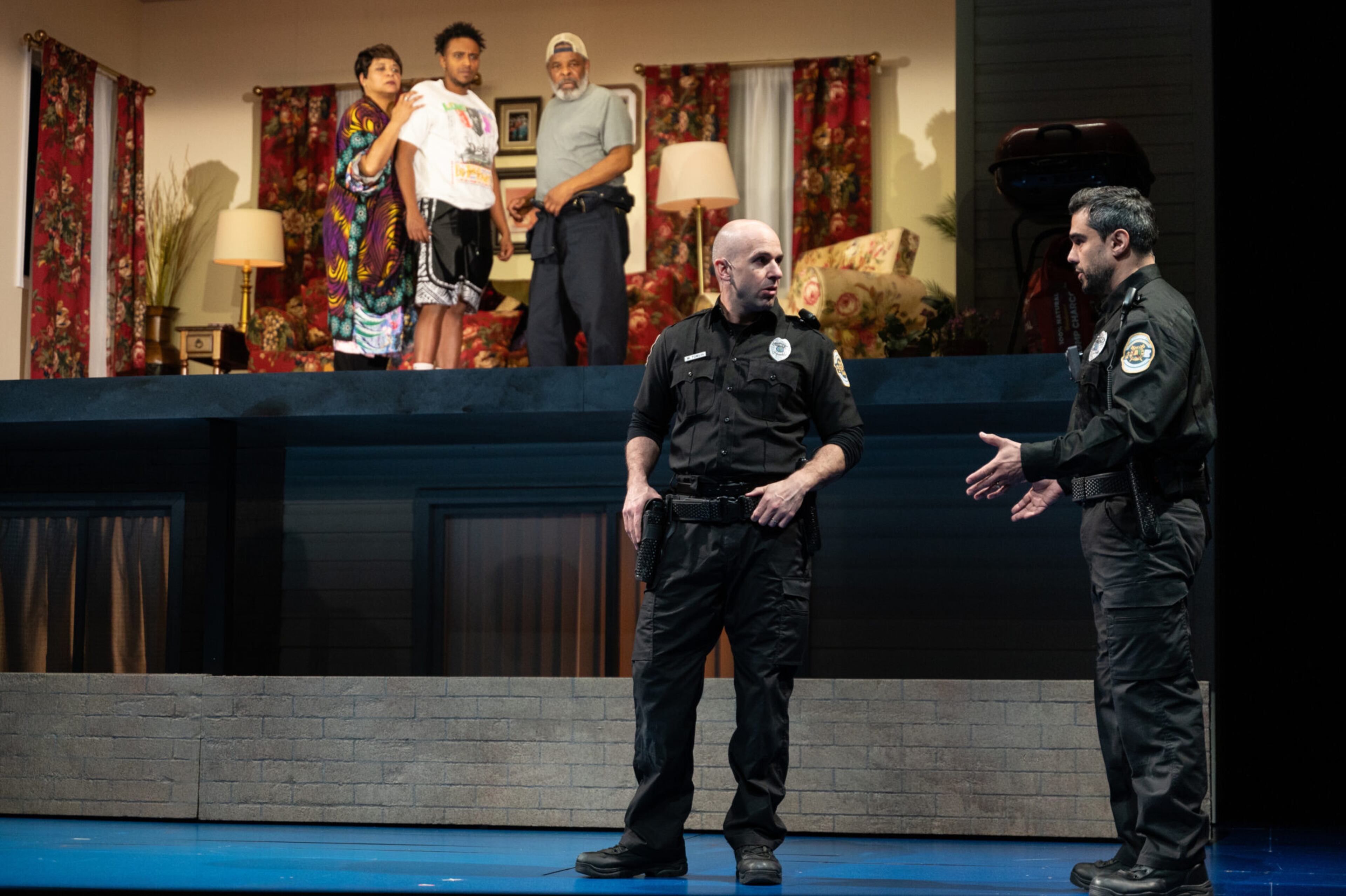 Caroline Stefanie Clay (from left), Cecil Blutcher and Raymond Anthony Thomas stare down at the police (Mark Bedard and Jorge Luna). Blutcher, as the couple's grandson Trent, witnesses a confrontation that leaves him with existential questions about being Black in today's society. Courtesy of Greg Mooney