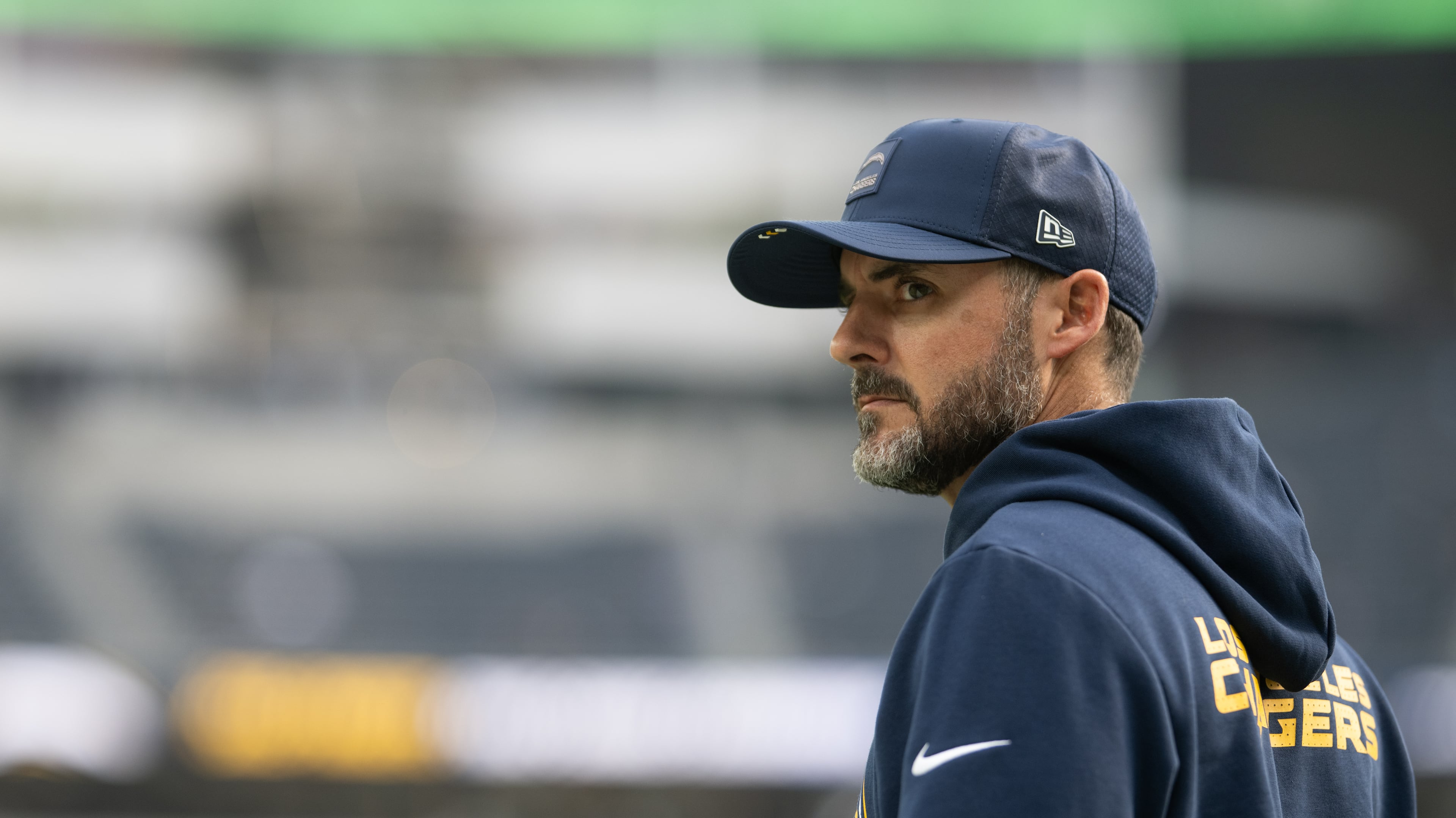 FILE - Los Angeles Chargers defensive coordinator Jesse Minter walks on the field before an NFL football game against the Las Vegas Raiders, Sunday, Nov. 30, 2025, in Inglewood, Calif. (AP Photo/Kyusung Gong, File)