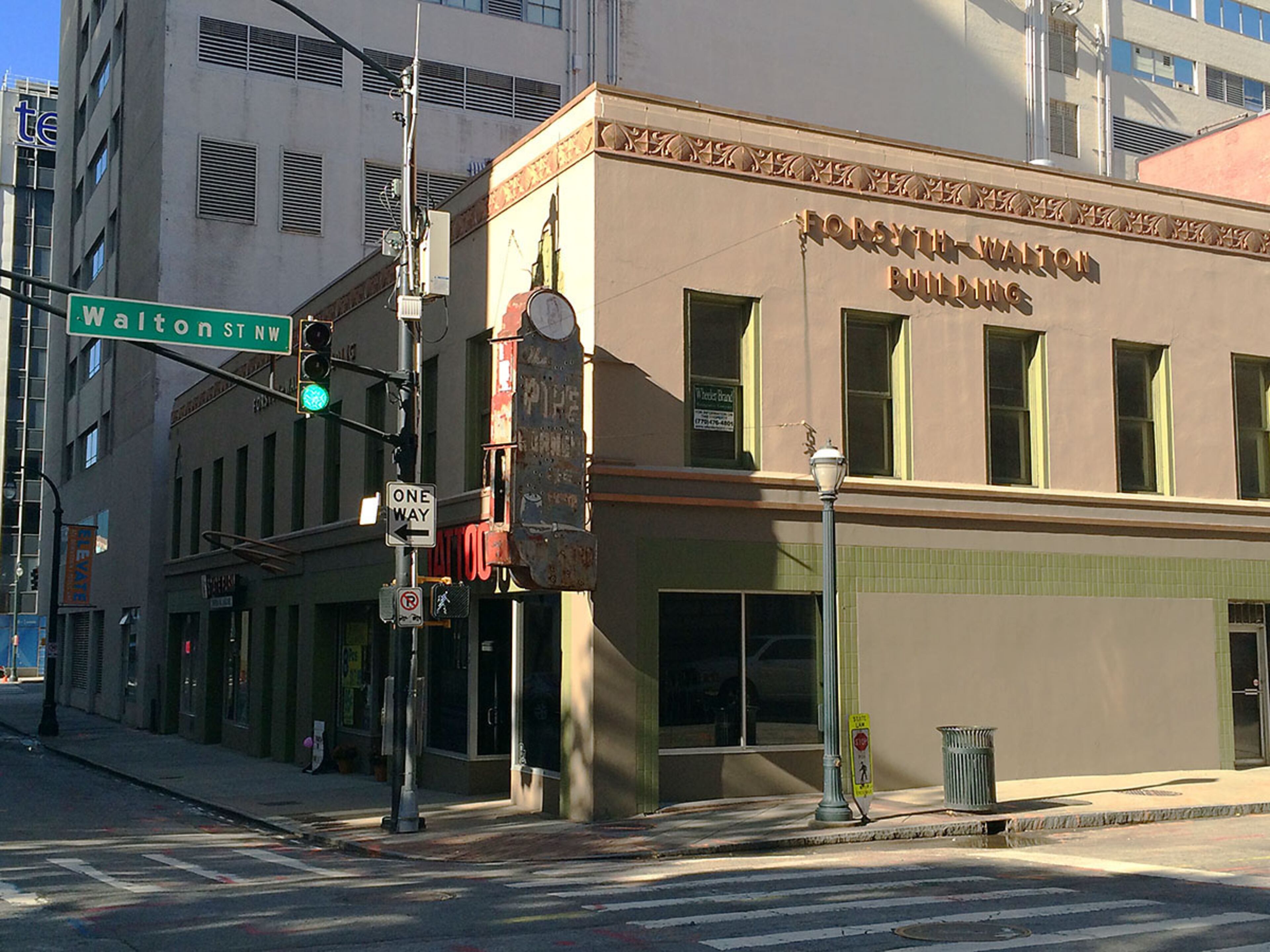 FORSYTH-WALTON BUILDING (52 Walton Street). Significance: One of few early commercial buildings remaining in the Fairlie Poplar District. Owners Westplan Investors plan to replace the building with a cooling station for a next-door data center, while possibly recreating the building's Art Deco facade on the first two floors. Read the APC's report here and learn more about the building's famous Pipe Corner sign here. (PETE CORSON / pcorson@ajc.com)