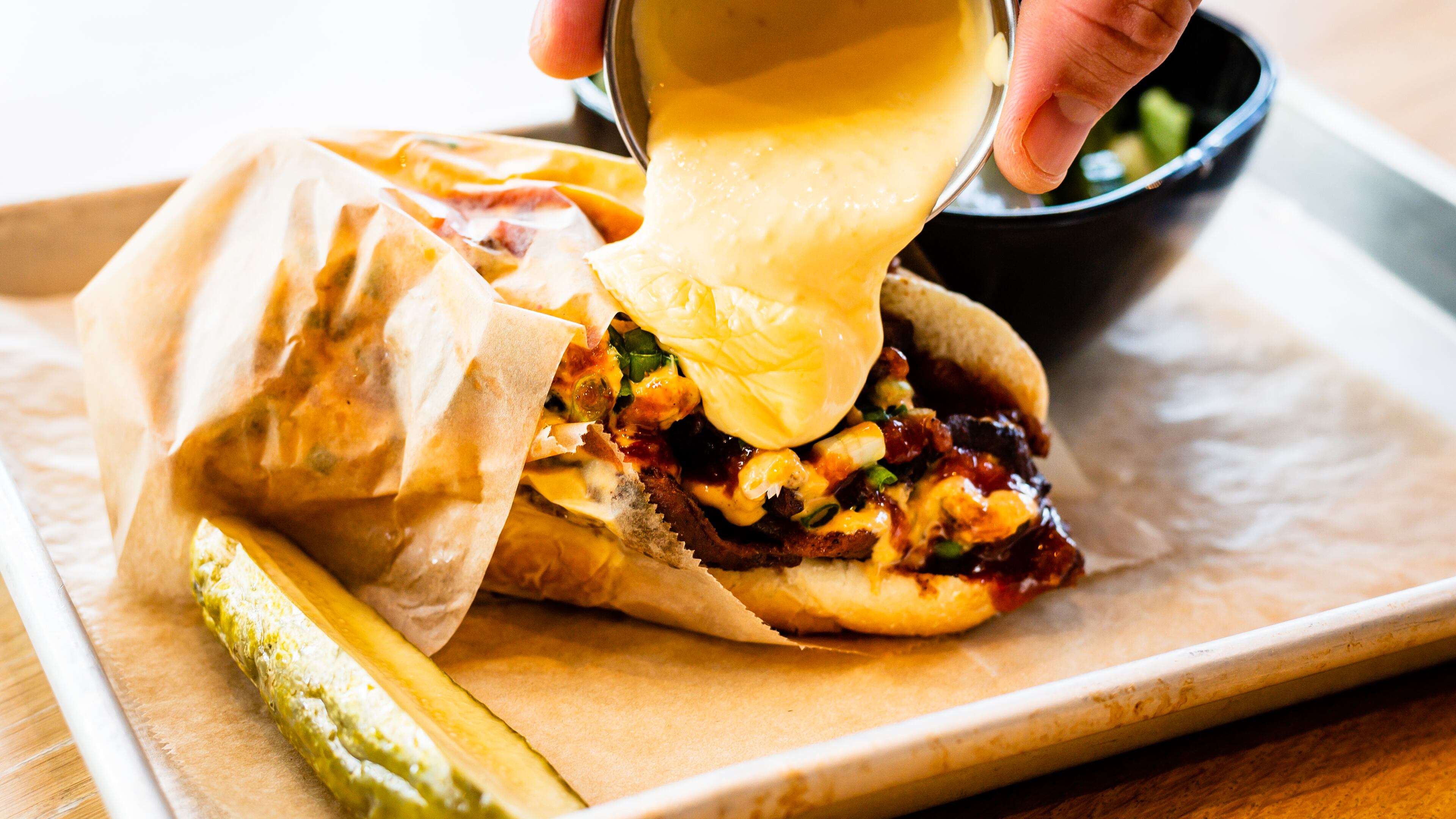 The Korean BBQ Philly at Sweetwater Taproom is engineered for maximum flavor.