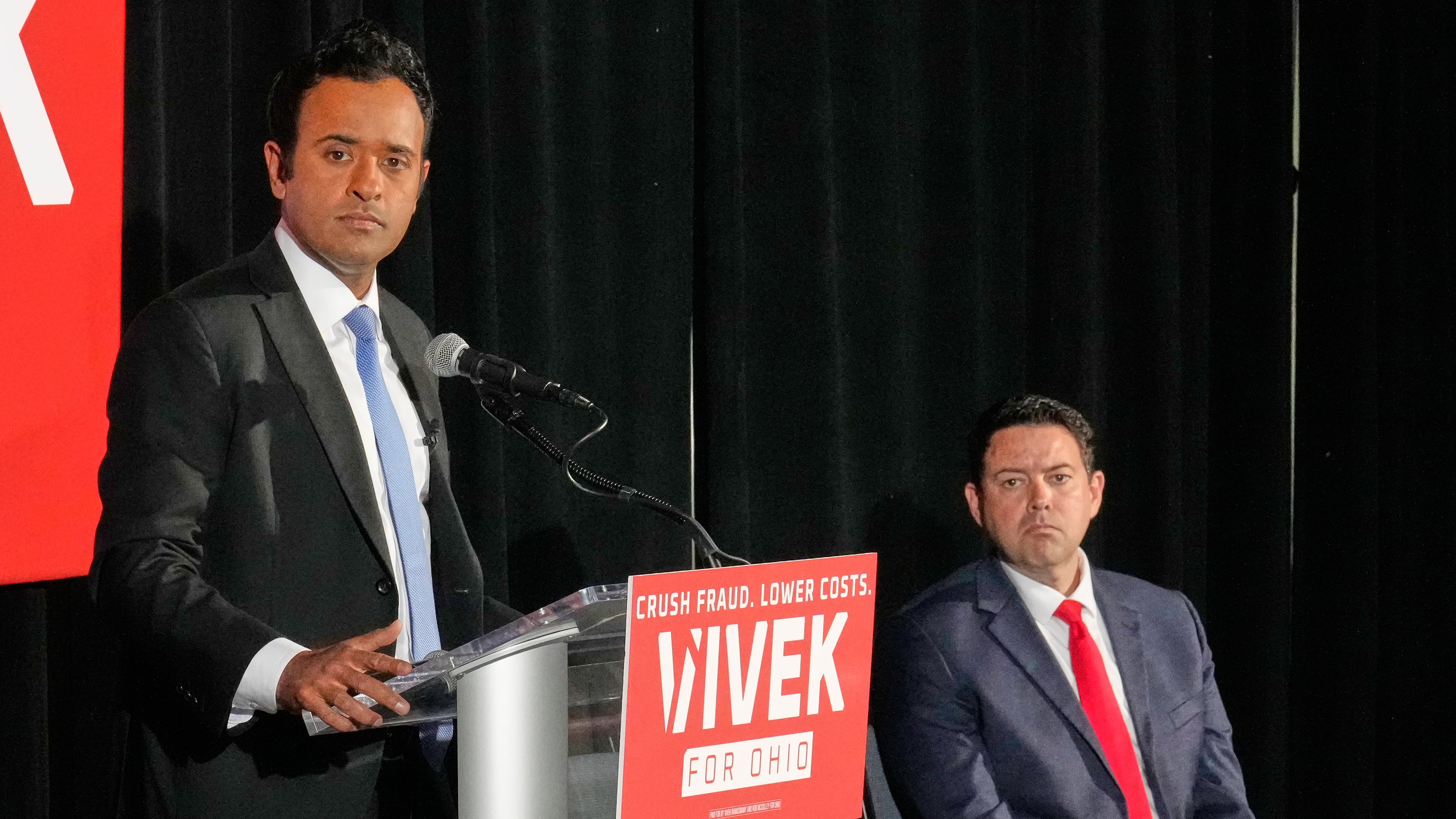 Vivek Ramaswamy, left, candidate for Governor in Ohio, and his running mate, Ohio Senate President Rob McColley, right, listen to a question during a news conference on Medicaid fraud in Columbus, Ohio, Tuesday, May 19, 2026. (AP Photo/Sue Ogrocki)