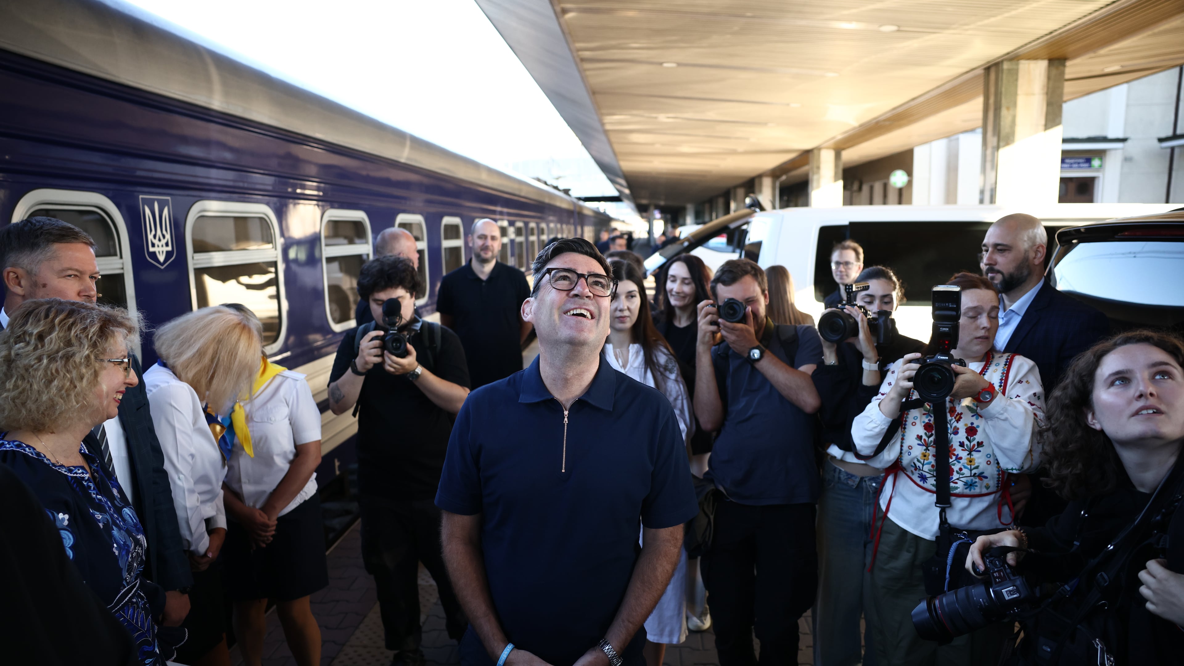 Britain's prime minister Andy Burnham, centre, smiles upon his arrival by train, in Kyiv, Monday, Aug. 24, 2026. (Henry Nicholls/Pool Photo via AP)