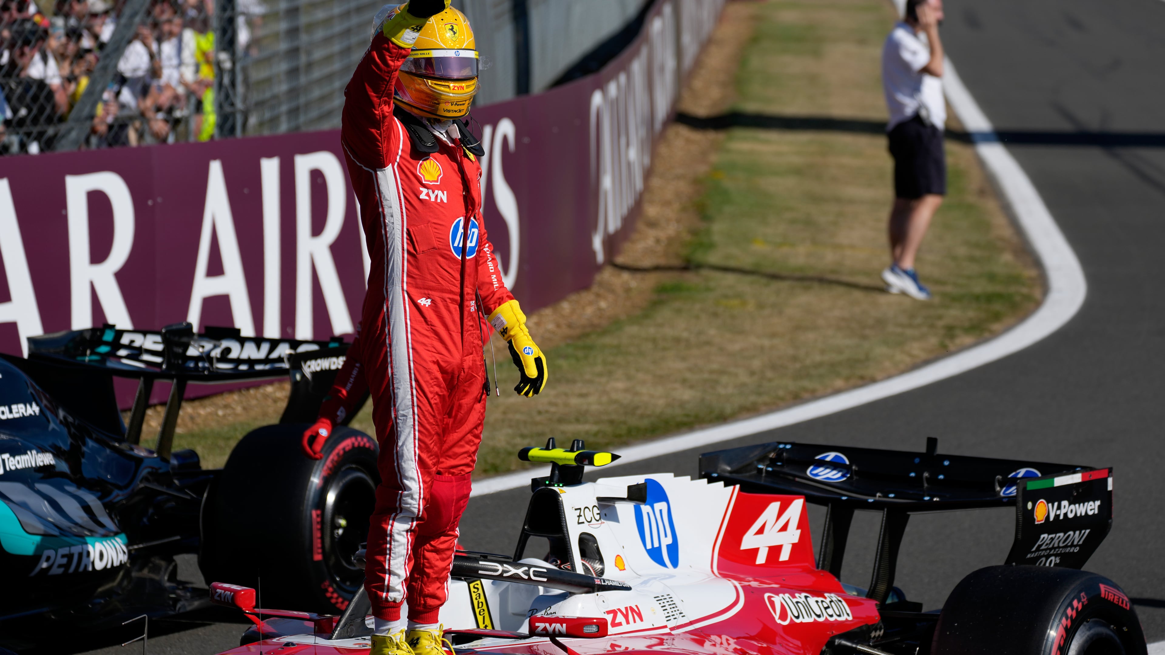 Ferrari driver Lewis Hamilton of Britain celebrates after setting a pole position for the sprint race at the British F1 Grand Prix, in Silverstone, England, Friday, July 3, 2026. (AP Photo/Darko Bandic)