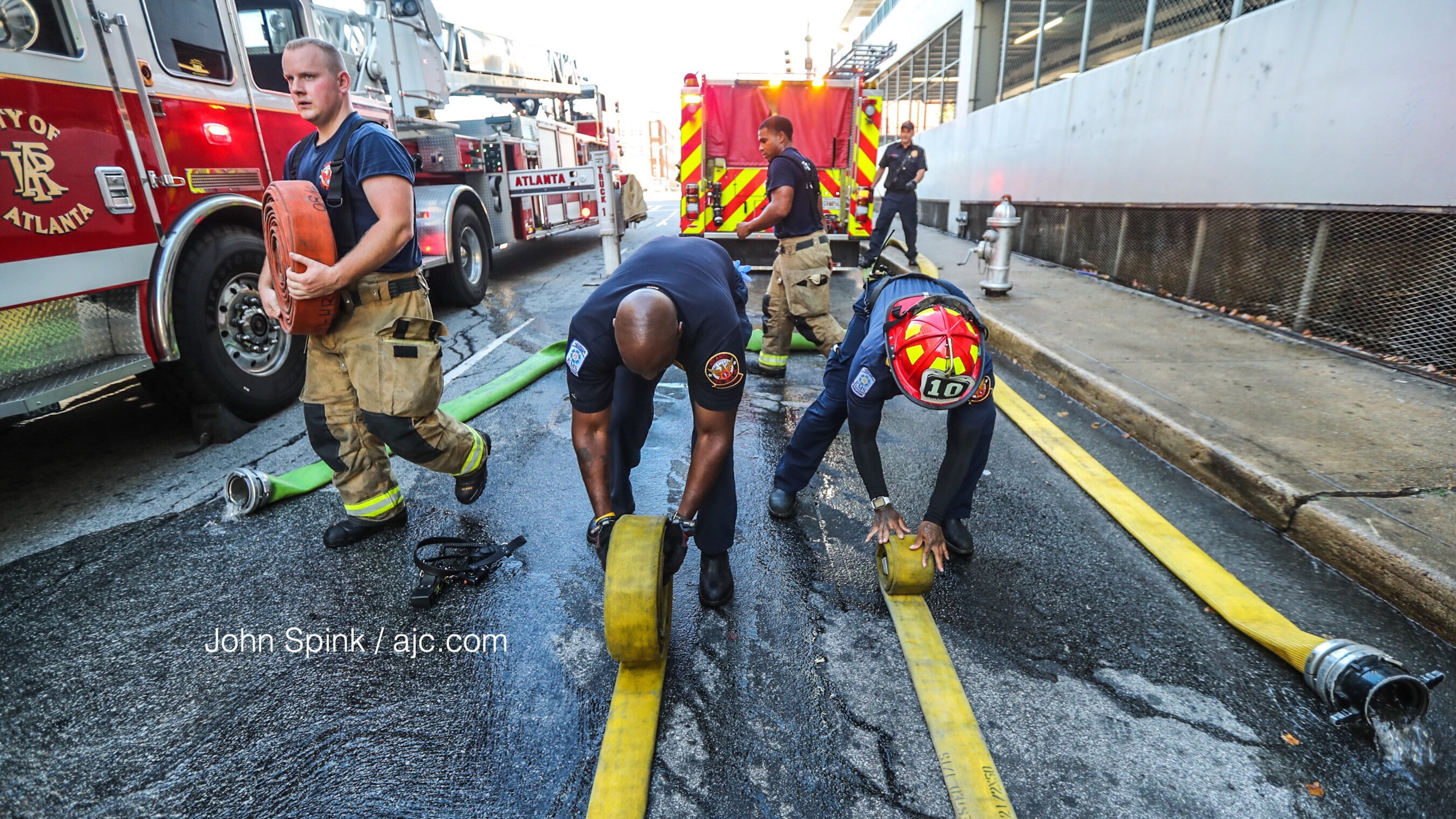 Atlanta firefighters respond to a fire at a parking deck on Decatur Street in downtown Atlanta on Tuesday morning.