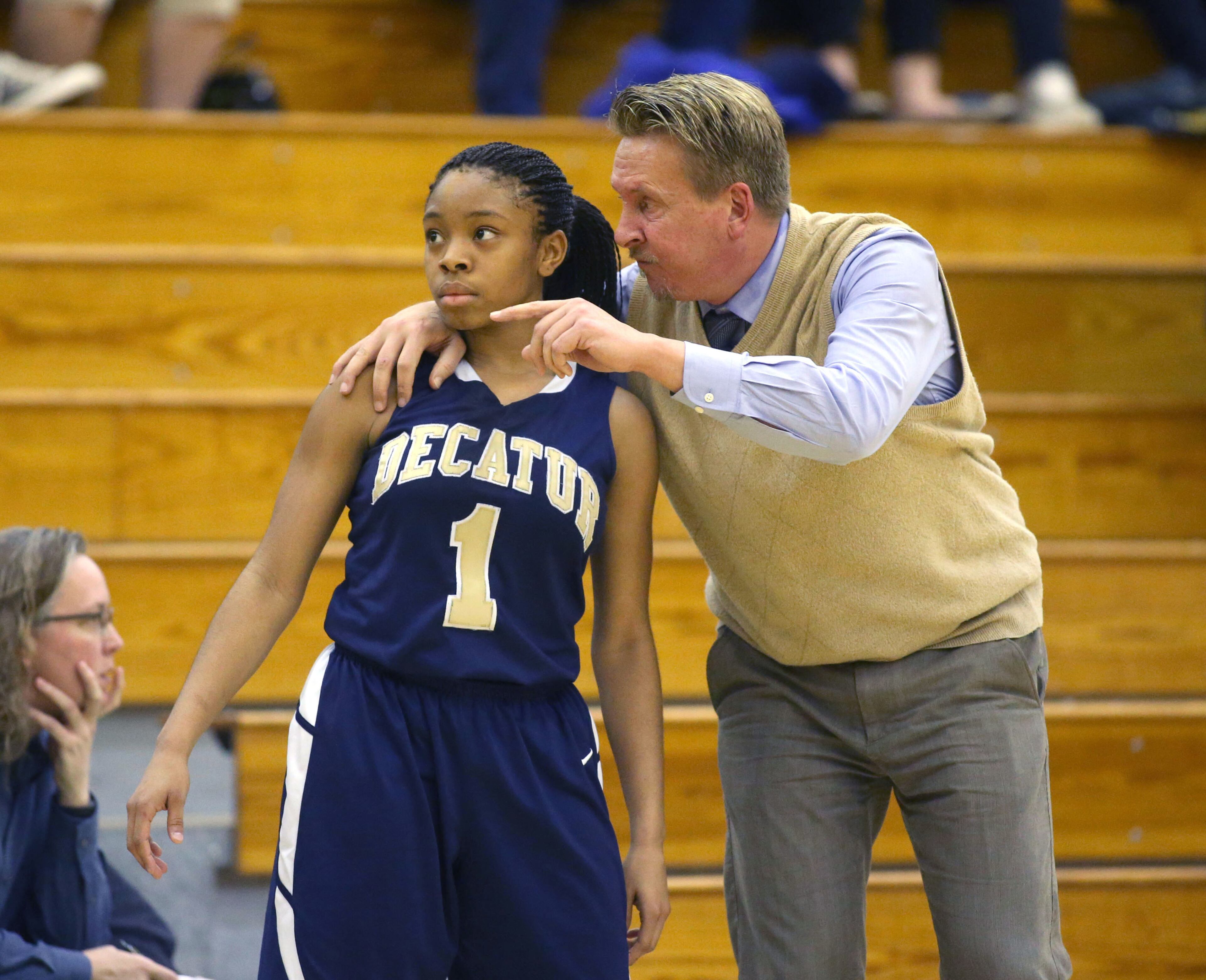 Decatur coach Bill Roberts, right, talks with player Jayla Morrow (1) during their game Monday night in Buford, Ga., February 24, 2014. . JASON GETZ / SPECIAL