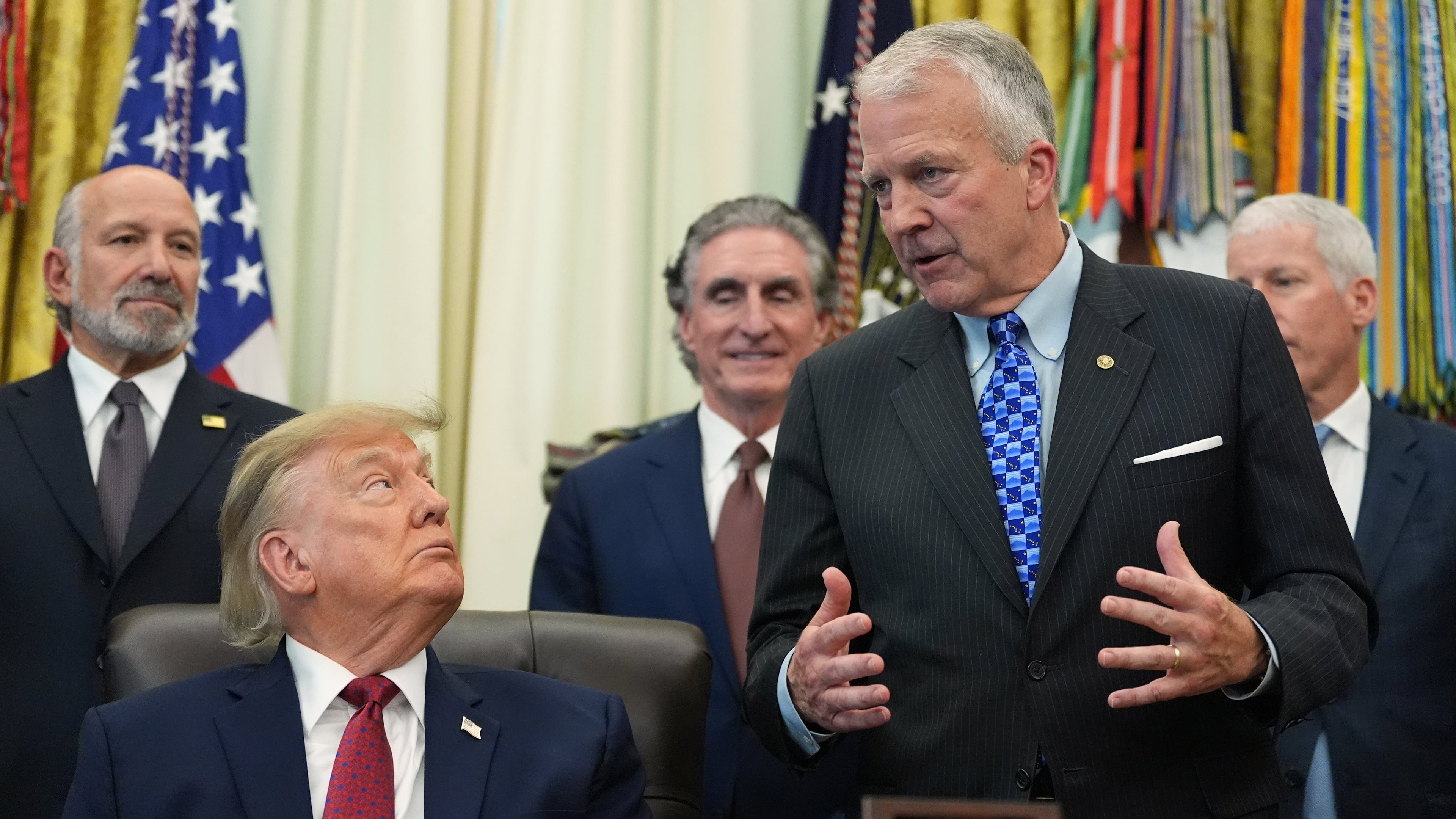 Sen. Dan Sullivan, R-Alaska, speaks in the Oval Office of the White House, Wednesday, Sept. 30, 2026, in Washington, as President Donald Trump, Commerce Secretary Howard Lutnick, Interior Secretary Doug Burgum and Energy Secretary Chris Wright listen. (AP Photo/Alex Brandon)