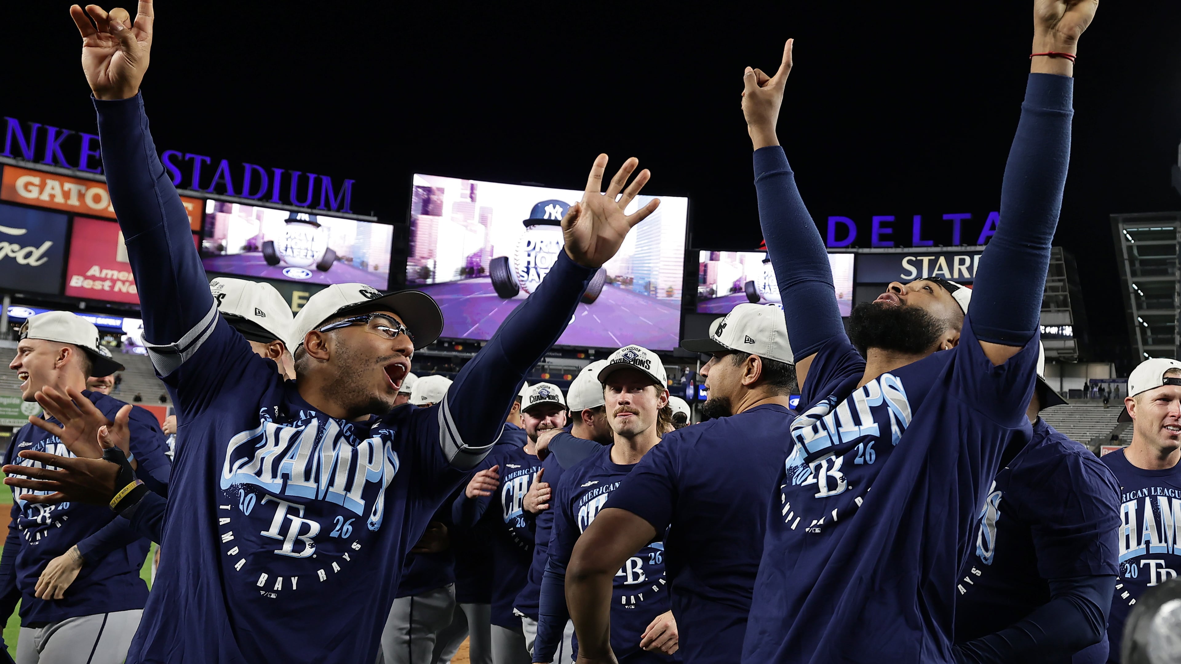 Tampa Bay Rays third baseman Junior Caminero, right, celebrates after the Rays defeated the New York Yankees in the second baseball game of a doubleheader Tuesday, Sept. 22, 2026, in New York. (AP Photo/Adam Hunger)