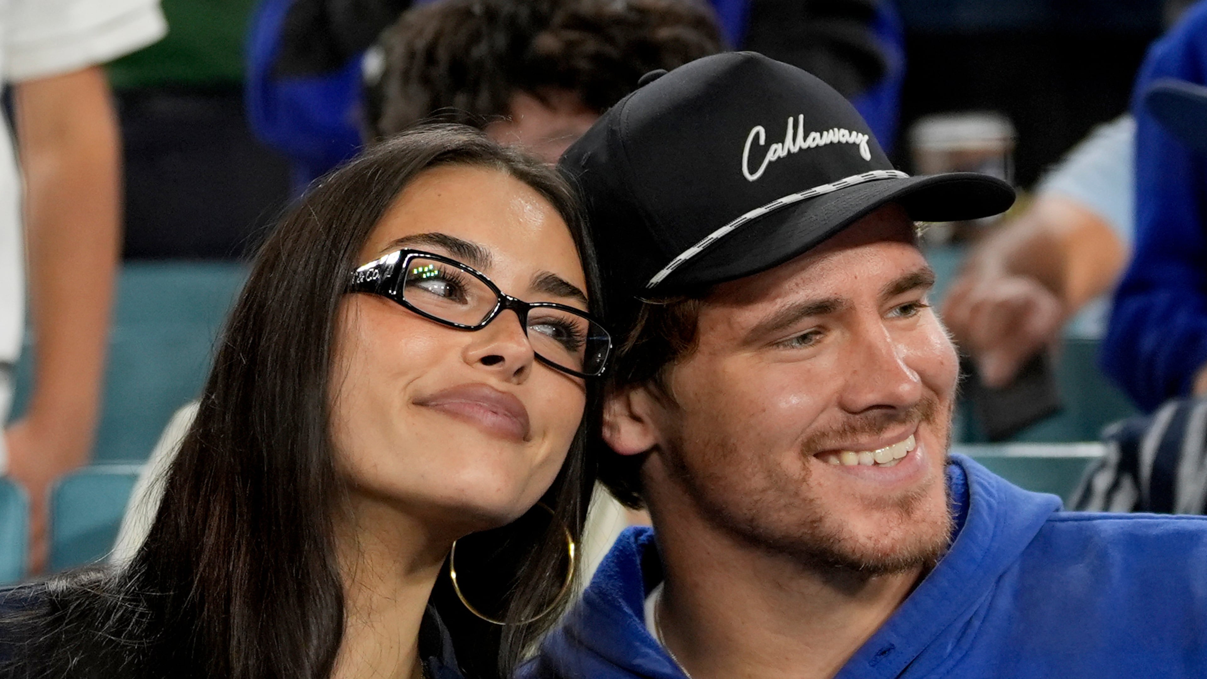 FILE - Los Angeles Chargers quarterback Justin Herbert and girlfriend Madison Beer watch the Toronto Blue Jays and the Los Angeles Dodgers compete during the seventh inning in Game 3 of baseball's World Series, Monday, Oct. 27, 2025, in Los Angeles. (AP Photo/Ashley Landis, File)