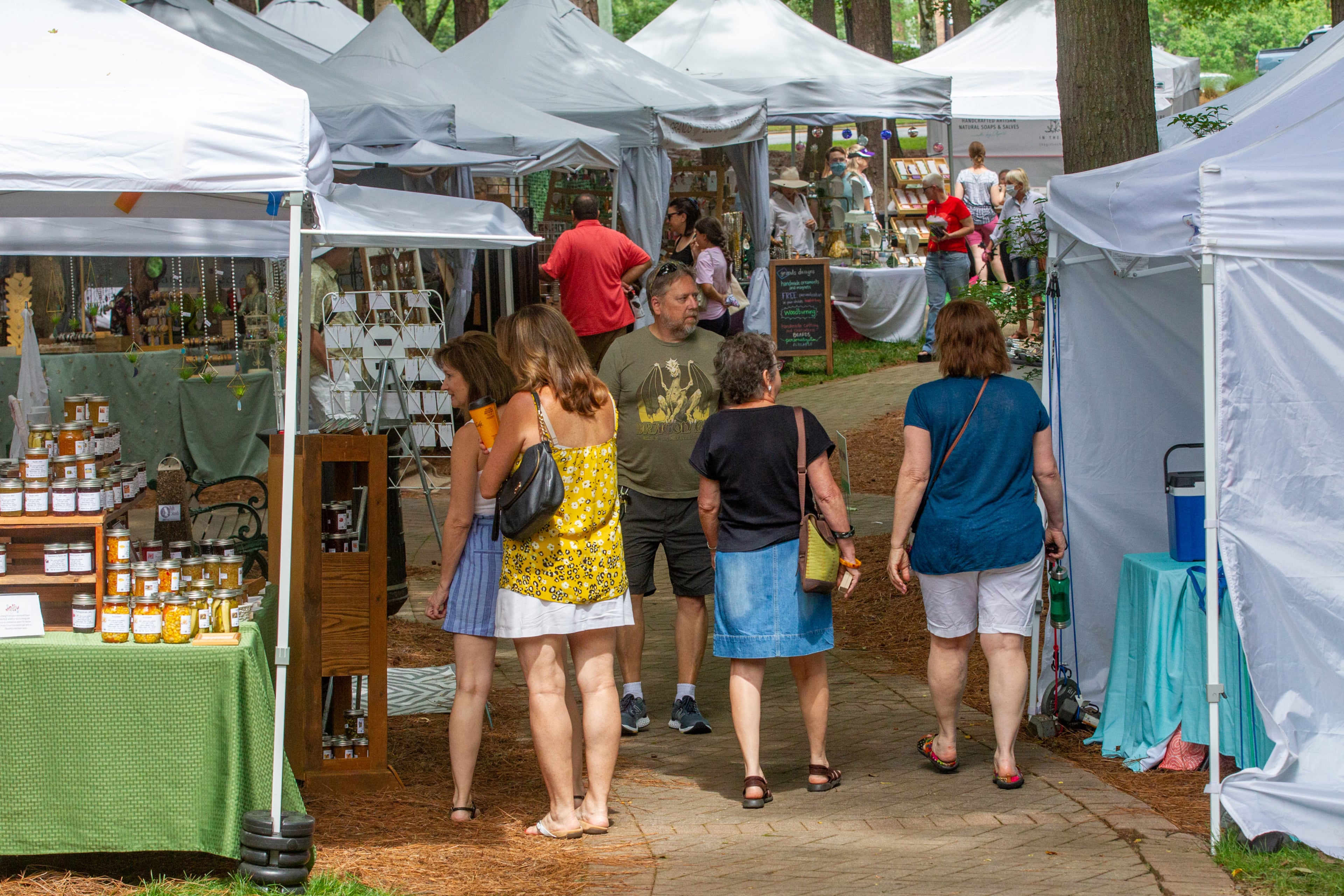 People check out the artists' tents during the Roswell Spring Arts and Crafts Festival on Sunday, June 13, 2021. (Photo: Steve Schaefer for The Atlanta Journal-Constitution)