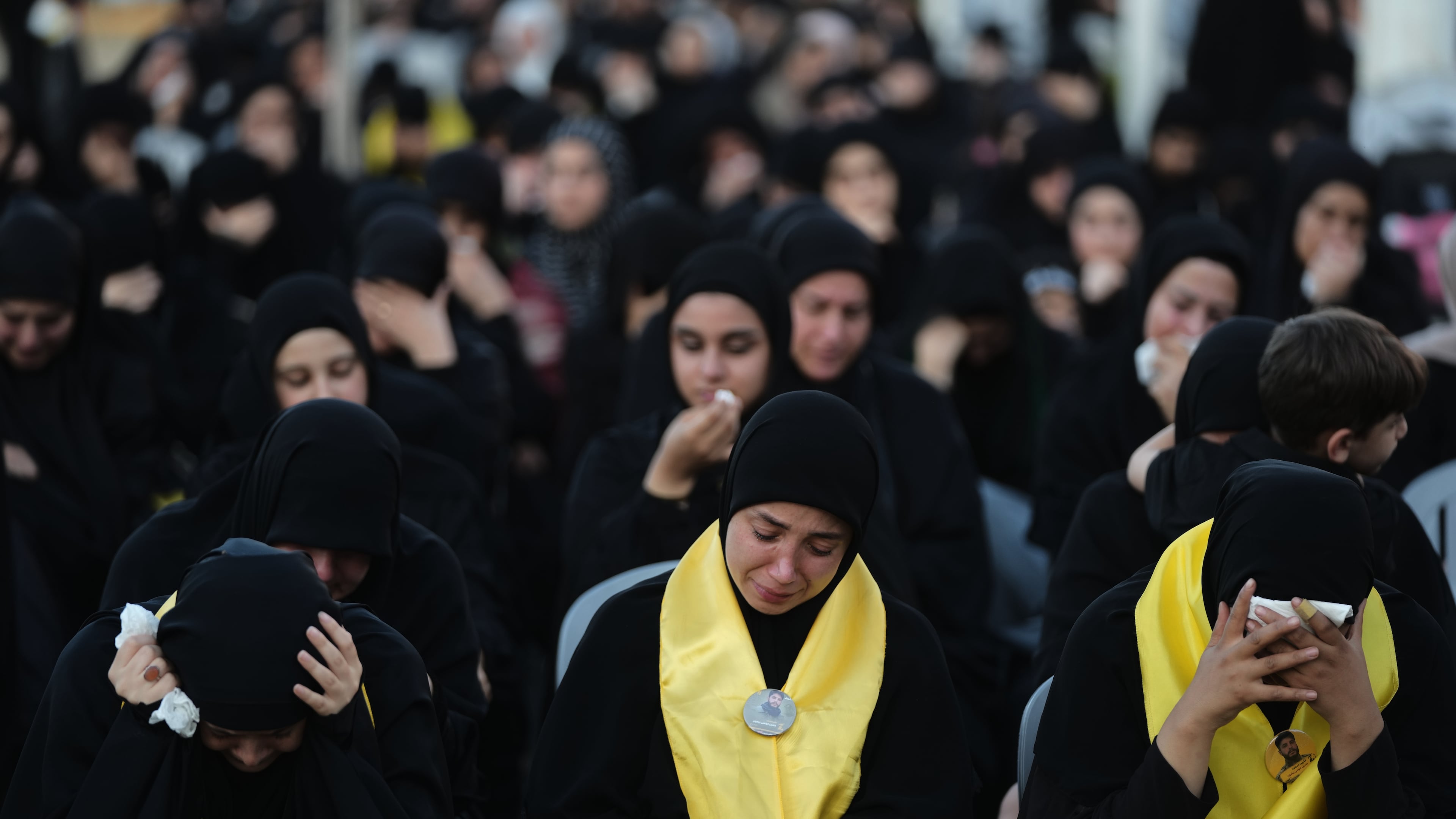 Women weep and mourn during a sermon marking the third day of Ashoura, the Shiite Muslim commemoration of the 7th-century death of Imam Hussein, the grandson of the Prophet Muhammad, in the southern port city of Tyre, Lebanon, Friday, June 19, 2026. (AP Photo/Hassan Ammar)