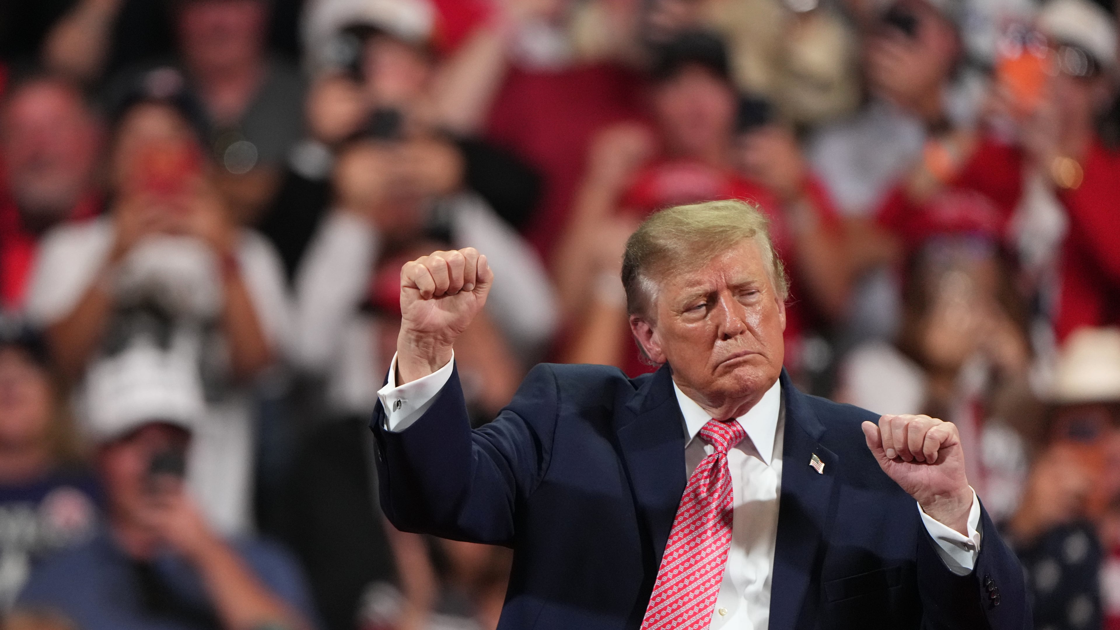 President Donald Trump dances at a campaign rally at Heartland Credit Union Arena, Monday, Oct. 19, 2026, in Park City, Kan. (AP Photo/Charlie Riedel)