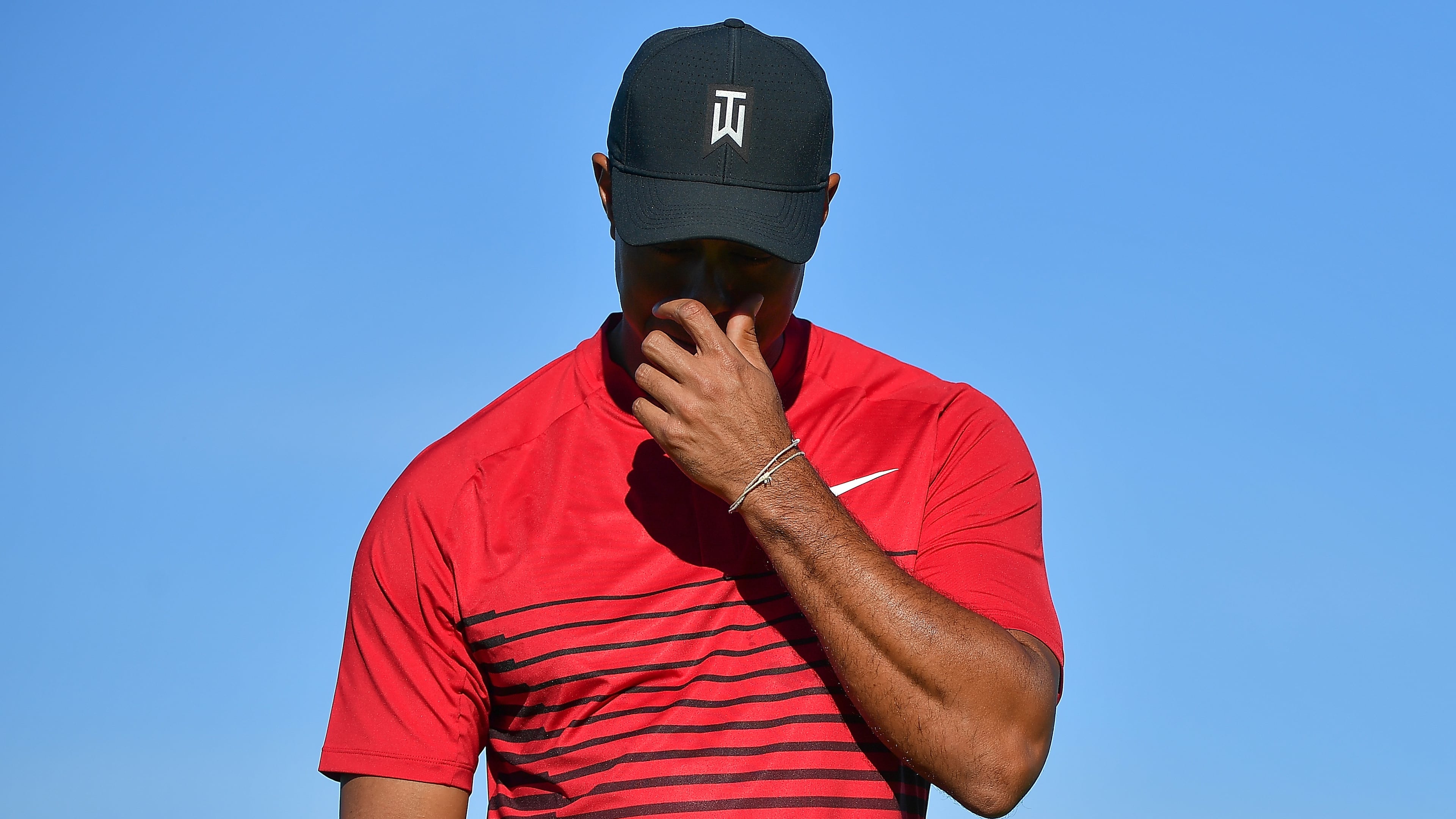 Tiger Woods reacts after a putt on the 13th green during the final round of the Farmers Insurance Open at Torrey Pines South on Jan. 28, 2018 in San Diego.