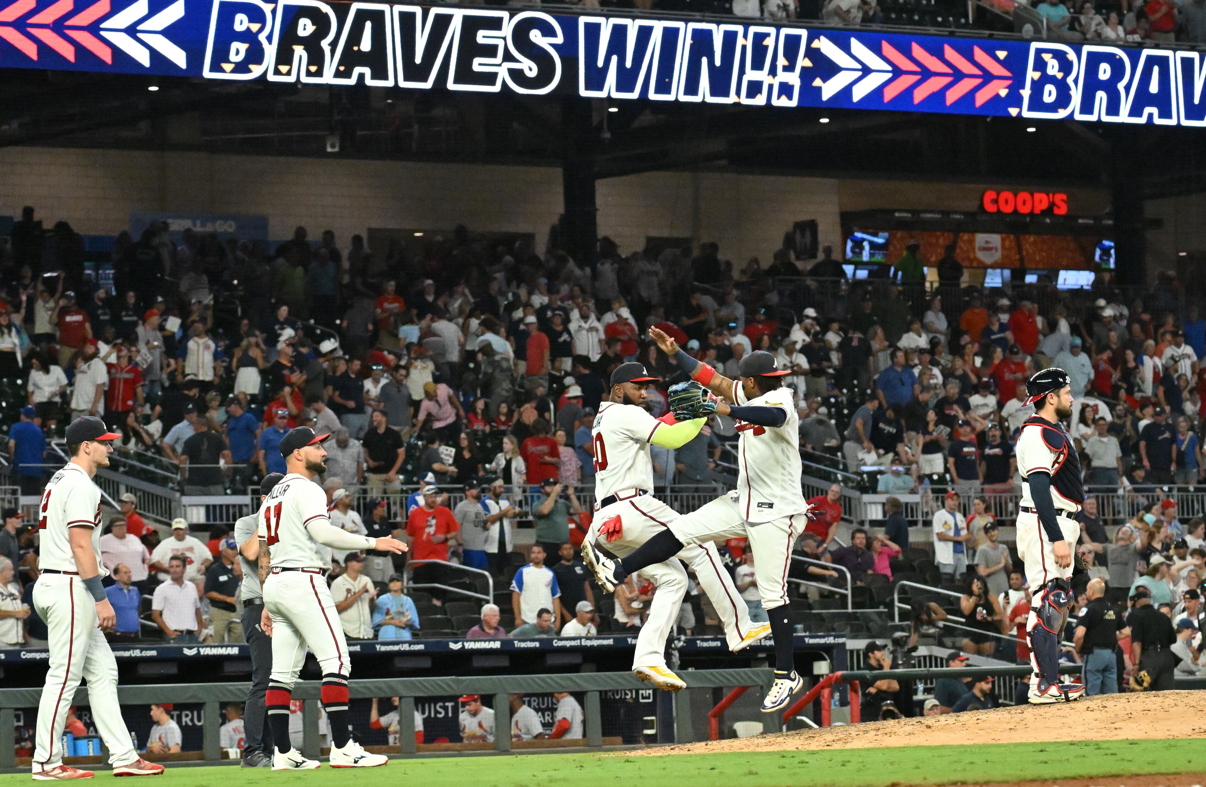 Atlanta Braves players celebrate their win over St. Louis Cardinals at Truist Park, Thursday, September 7, 2023, in Atlanta. Atlanta Braves won 8-5 over St. Louis Cardinals. (Hyosub Shin / Hyosub.Shin@ajc.com)