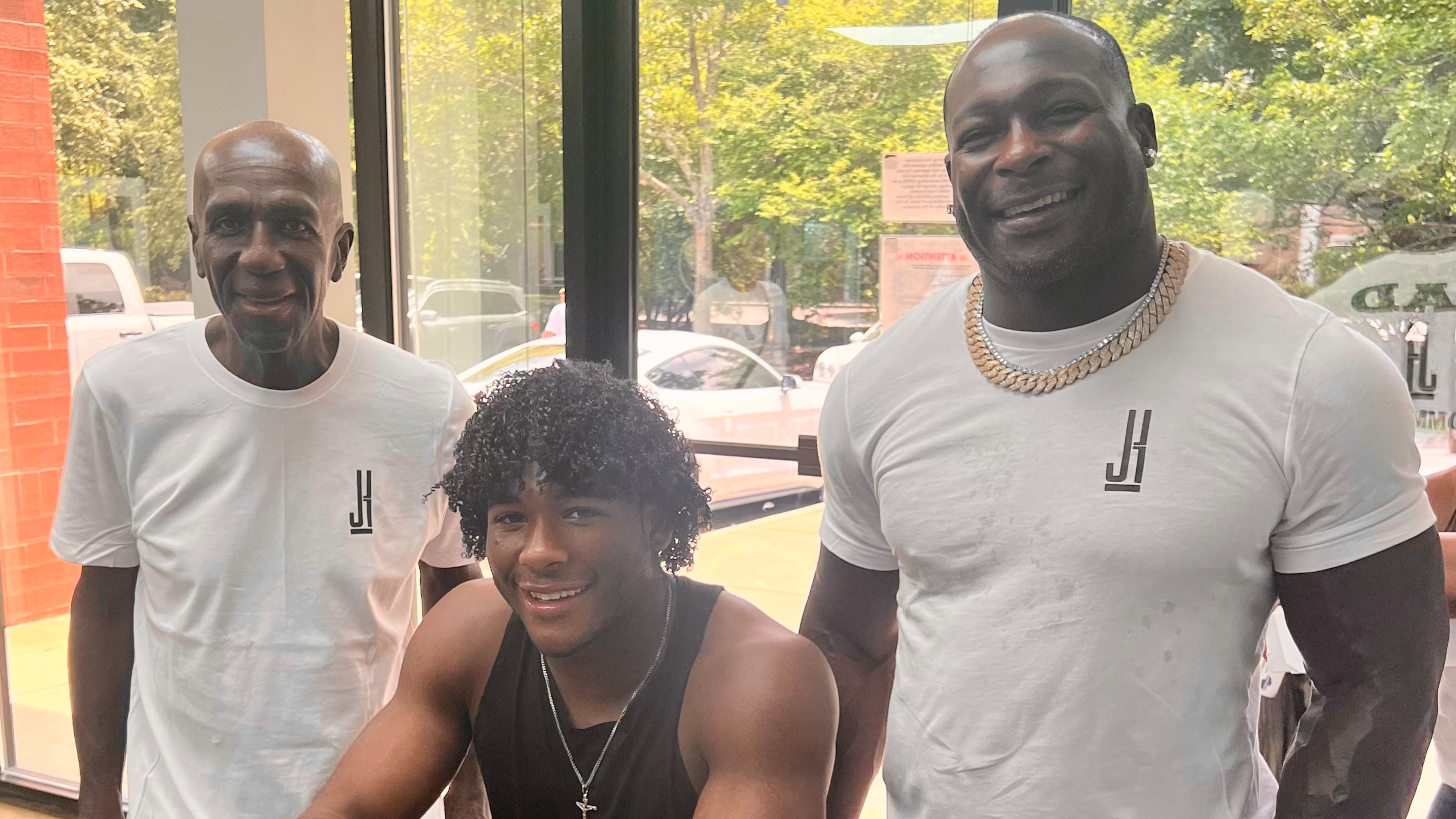 Justice Haynes and his father Verron Haynes (right) and grandfather Ulric "Buggy" Haynes (left) on July 17, 2022 after Justice Haynes verbally committed to play college football for Alabama. (Courtesy)