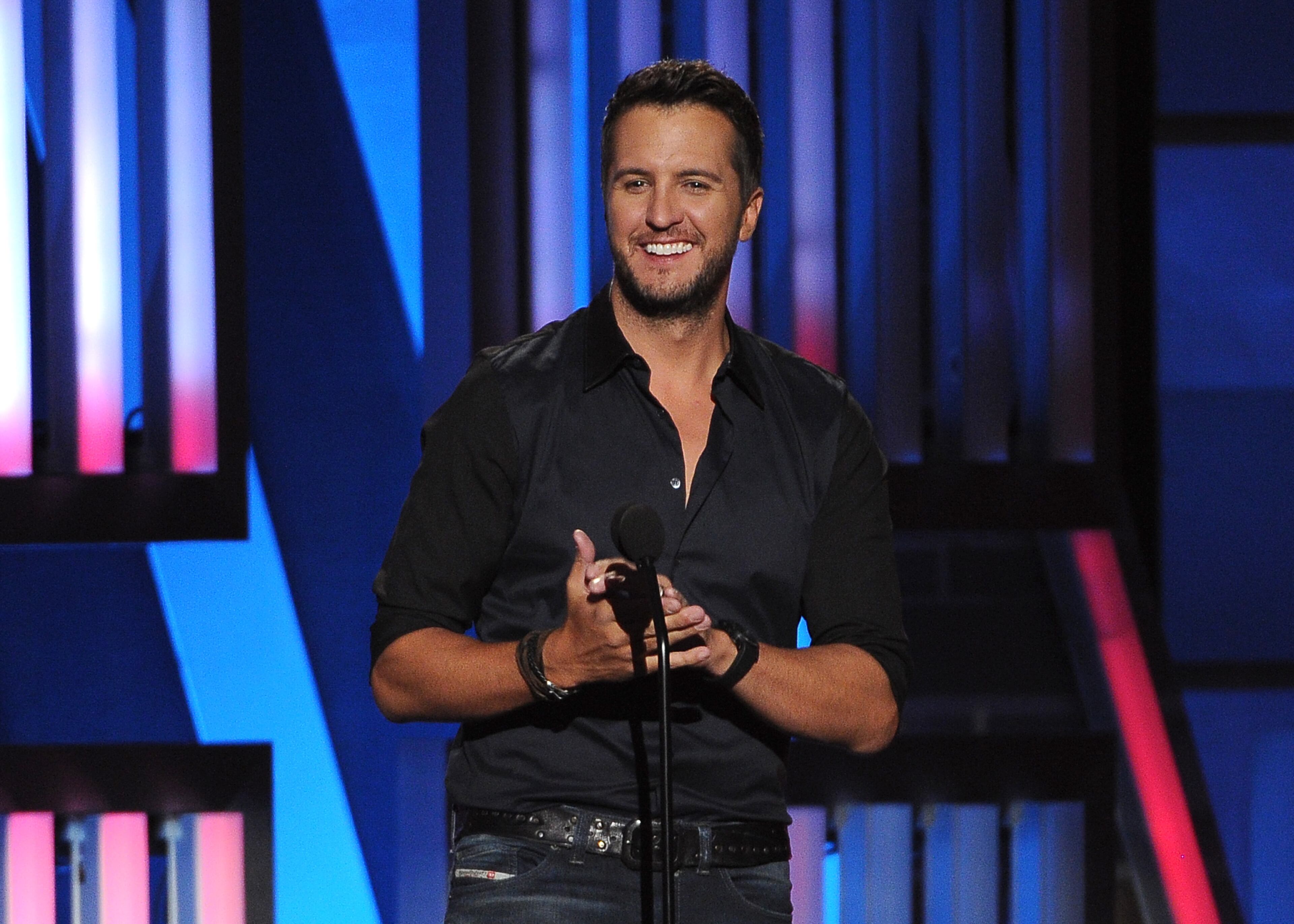 Luke Bryan performs at ACM Presents an All-Star Salute to the Troops on Monday, April 7, 2014, in Las Vegas. (Photo by Chris Pizzello/Invision/AP)
