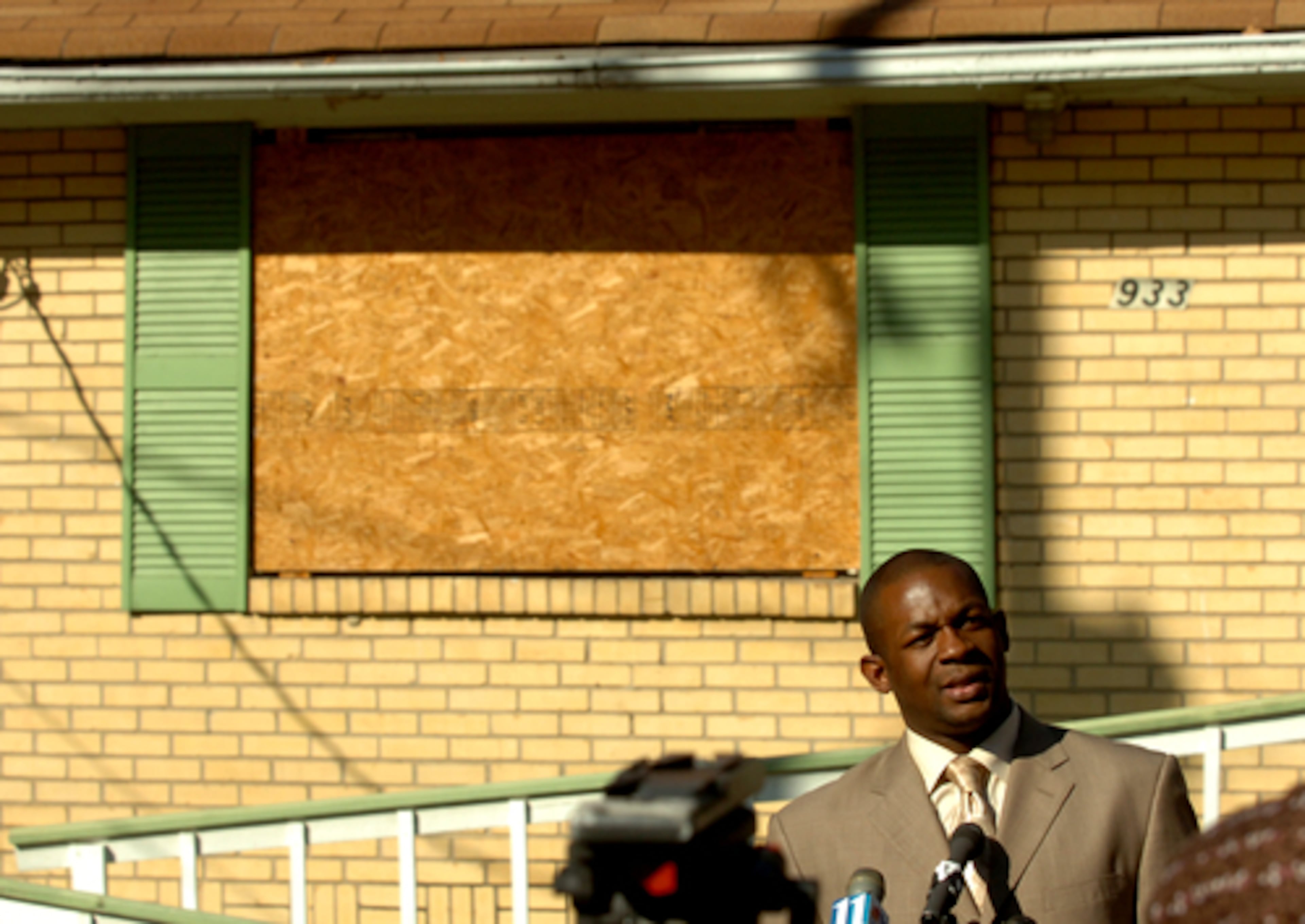 The Rev. Markel Hutchins holds a news conference Nov. 20, 2007, to talk about the one-year anniversary of Johnston's death, in front of her house.