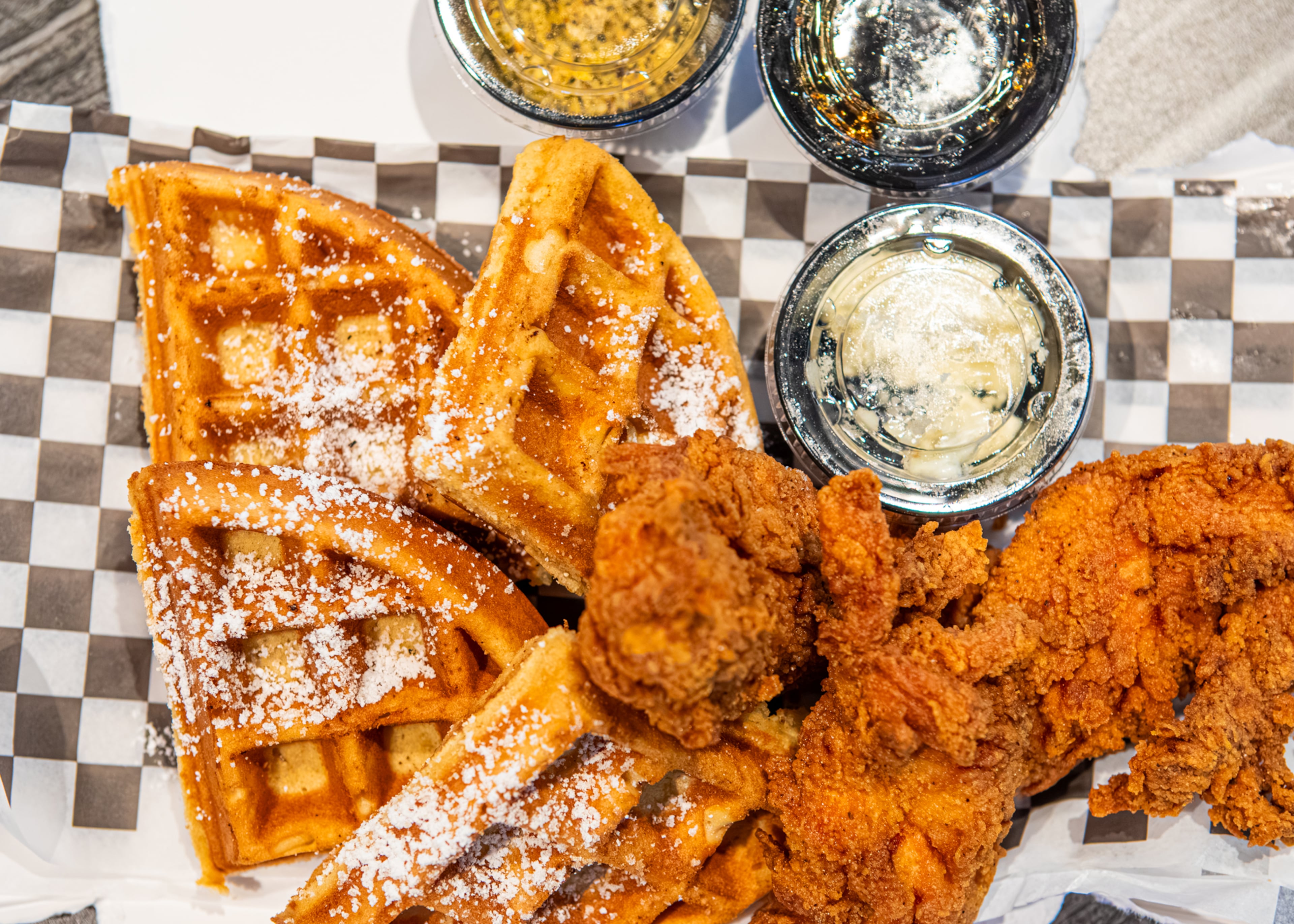 Waffle with Chicken Tenders made and styled by Johnny's Chicken & Waffles in Atlanta, Ga., Wednesday, May 6, 2026. (Aaliyah Man for the AJC)